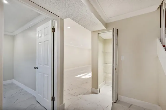 a bathroom with a glass shower door and mirror