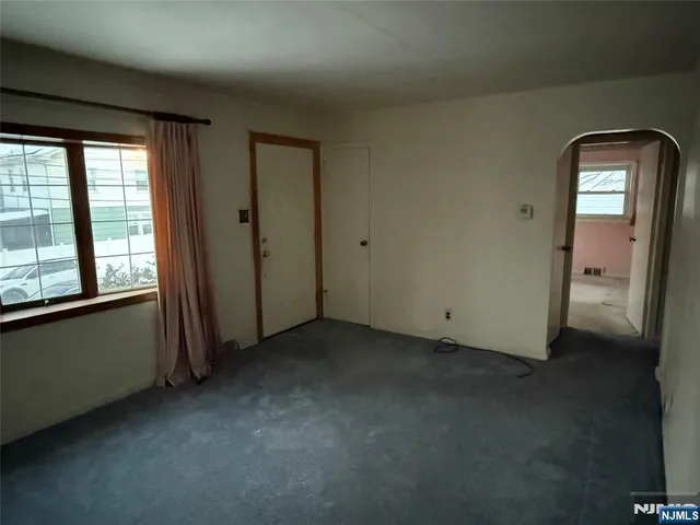 a kitchen with a refrigerator and a sink