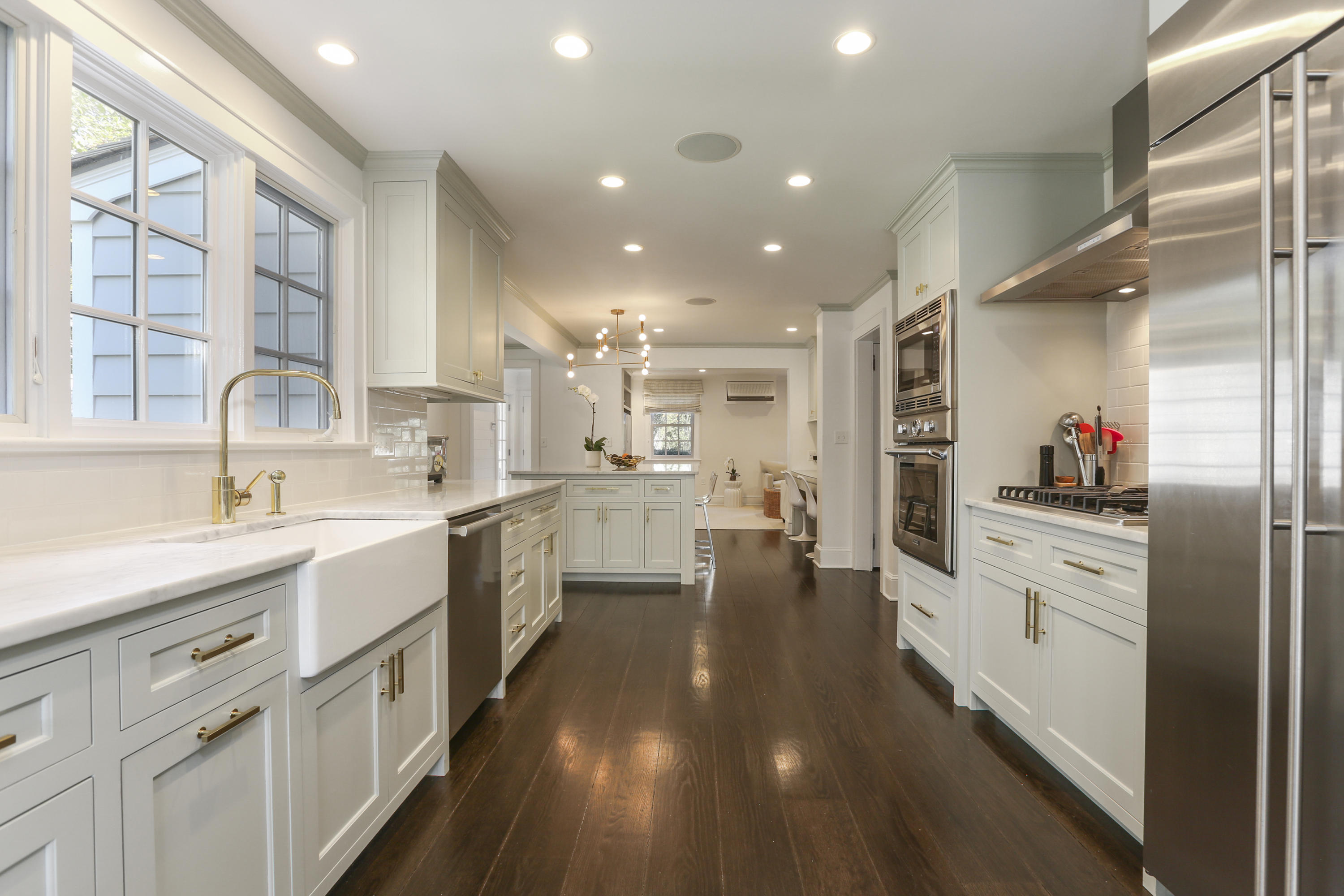 7 Bryan Road Norwalk, CT 06853 - Photo 15 of 37 a kitchen with white cabinets and appliances