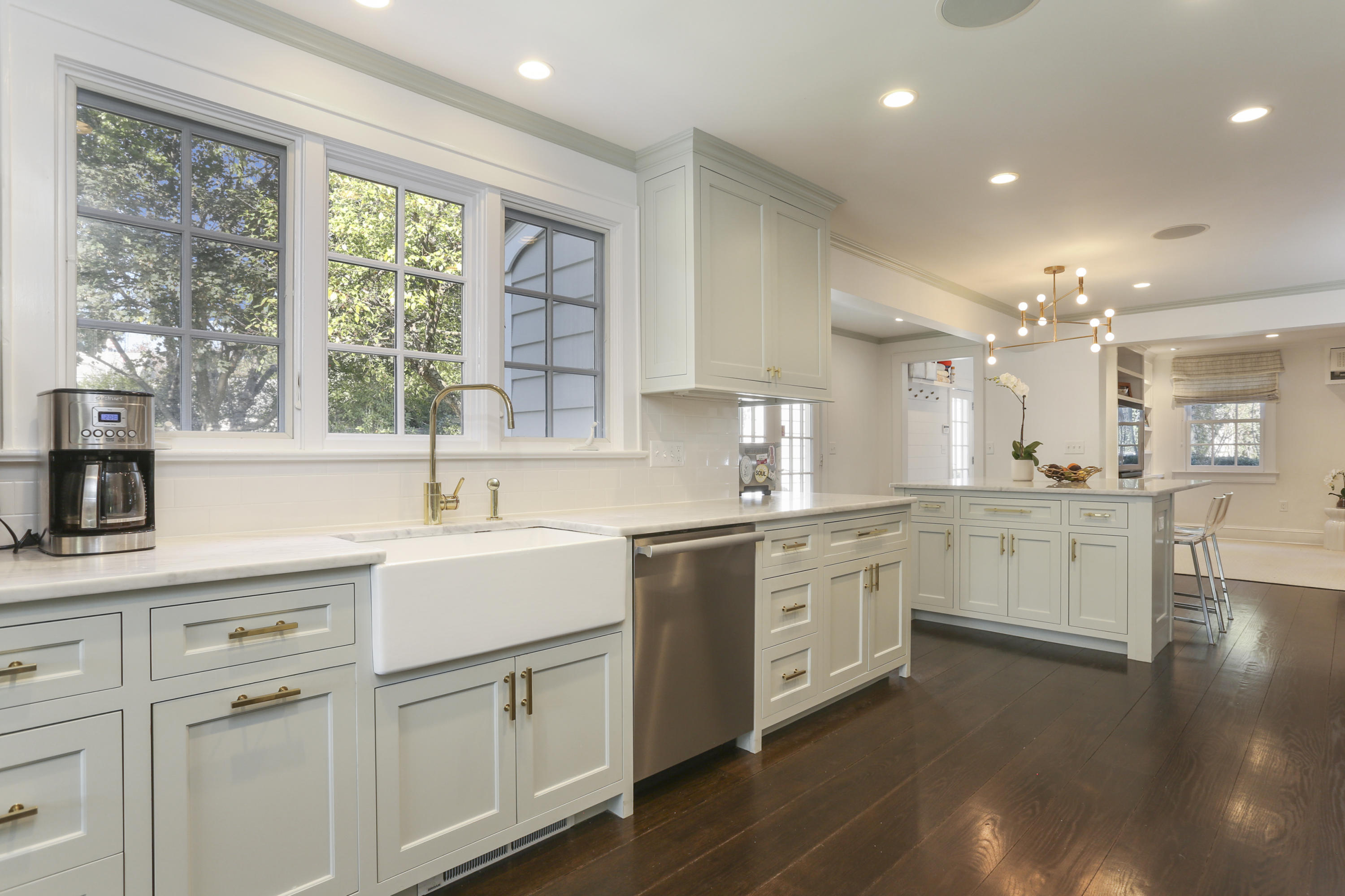 7 Bryan Road Norwalk, CT 06853 - Photo 16 of 37 a kitchen with white cabinets and white appliances