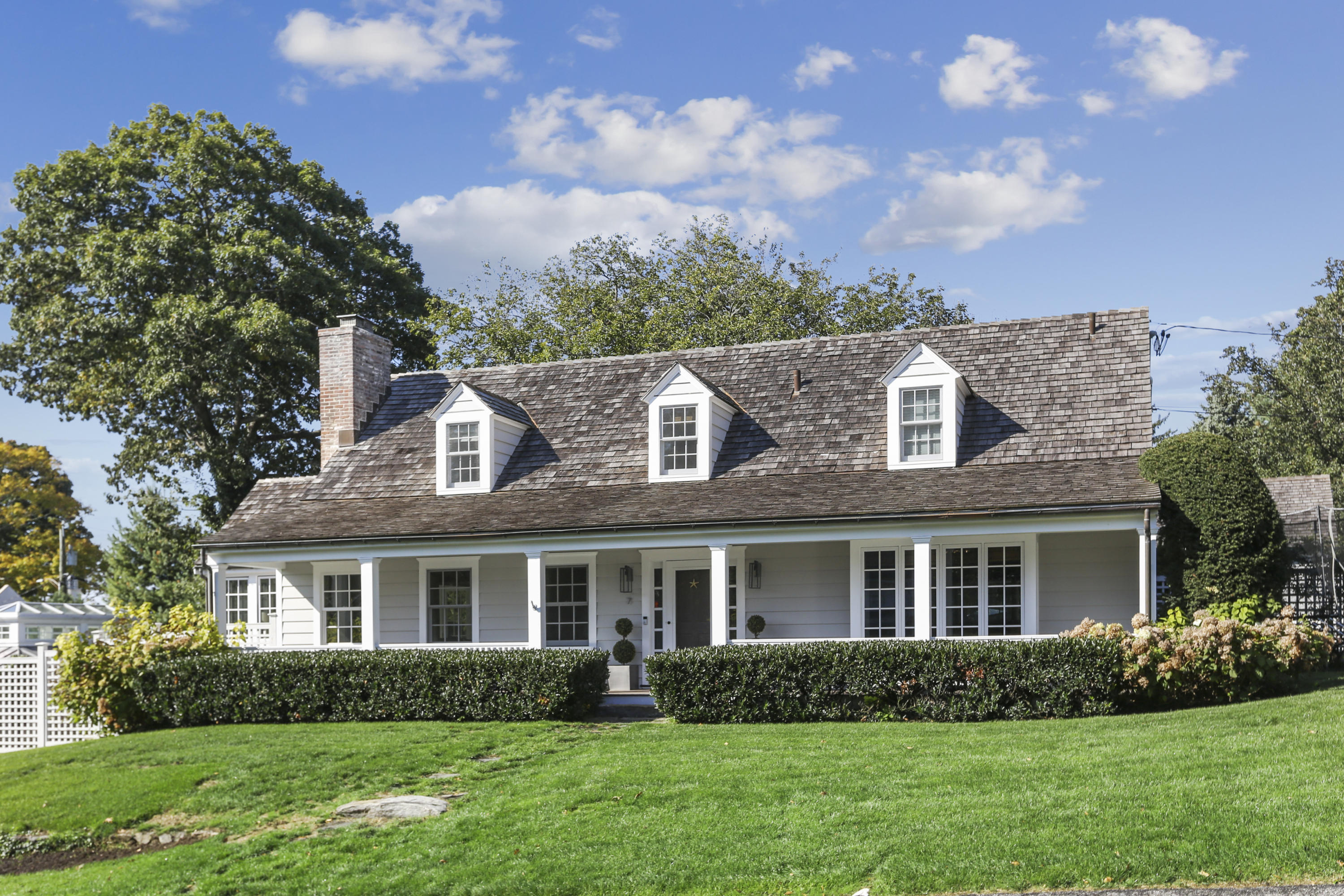 7 Bryan Road Norwalk, CT 06853 - Photo 2 of 37 a front view of a house with a garden