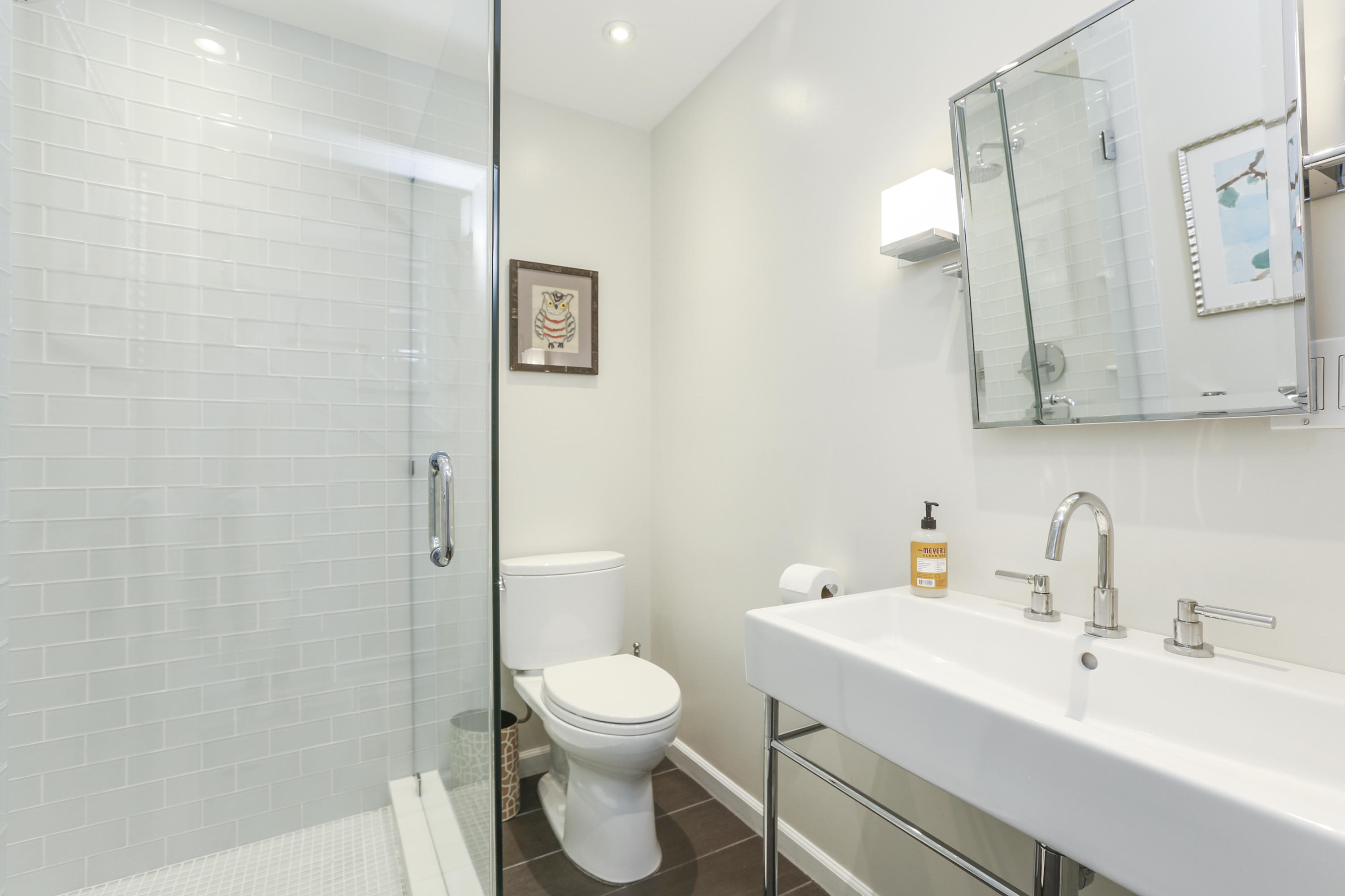 7 Bryan Road Norwalk, CT 06853 - Photo 22 of 37 a bathroom with a toilet sink a mirror and vanity
