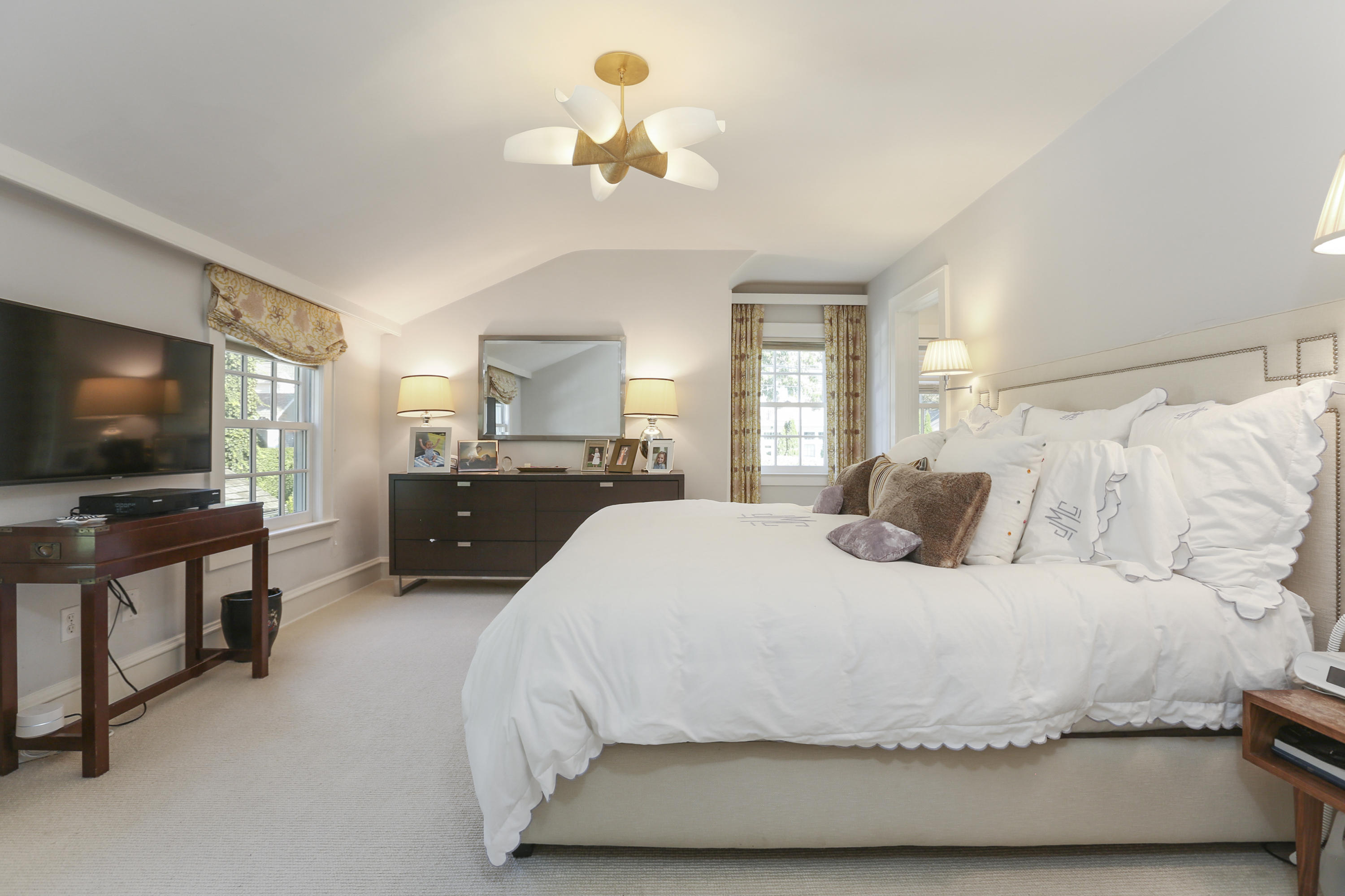 7 Bryan Road Norwalk, CT 06853 - Photo 24 of 37 a spacious bedroom with a bed and a flat screen tv