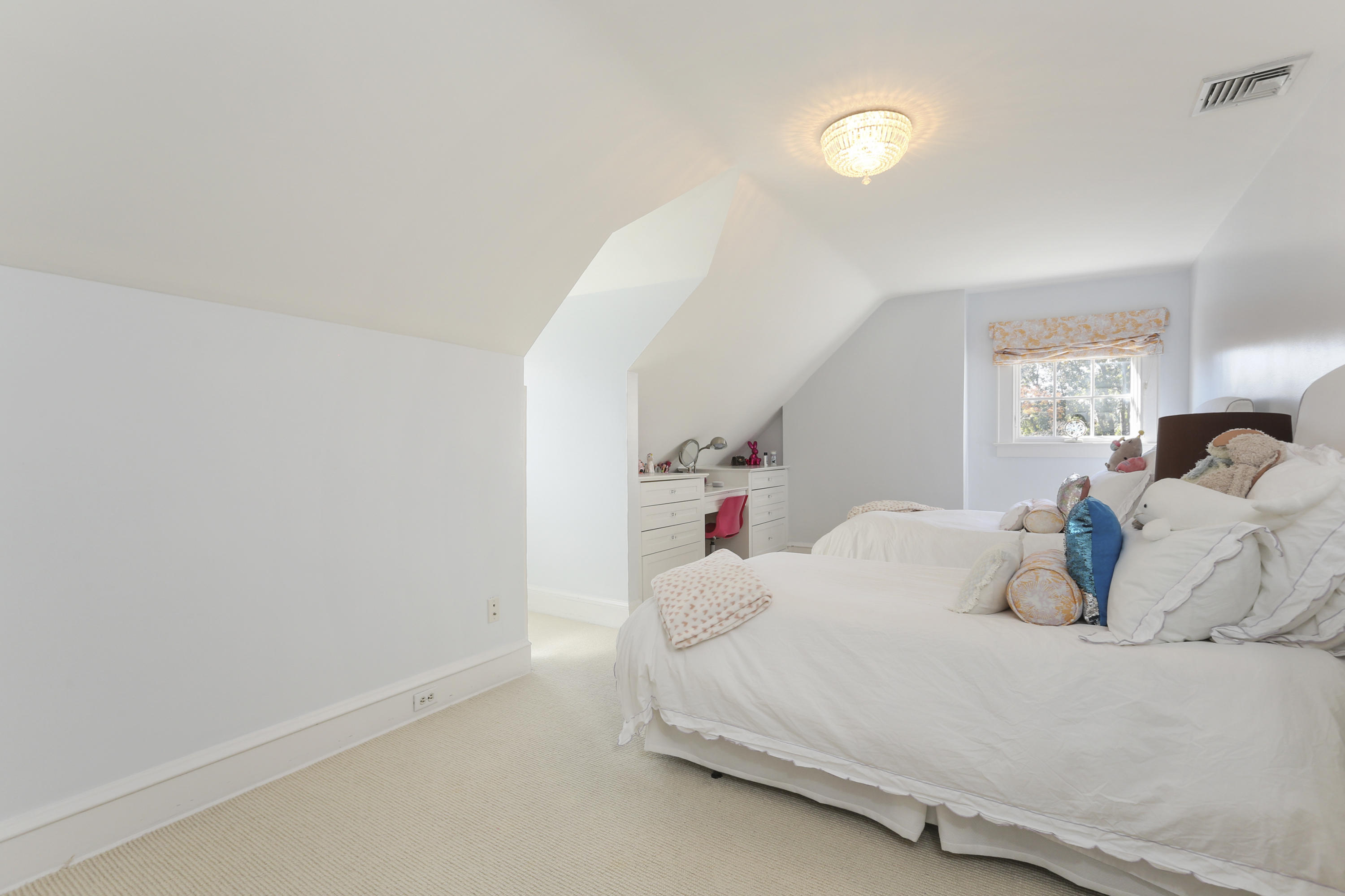 7 Bryan Road Norwalk, CT 06853 - Photo 29 of 37 a bedroom with a bed and a potted plant