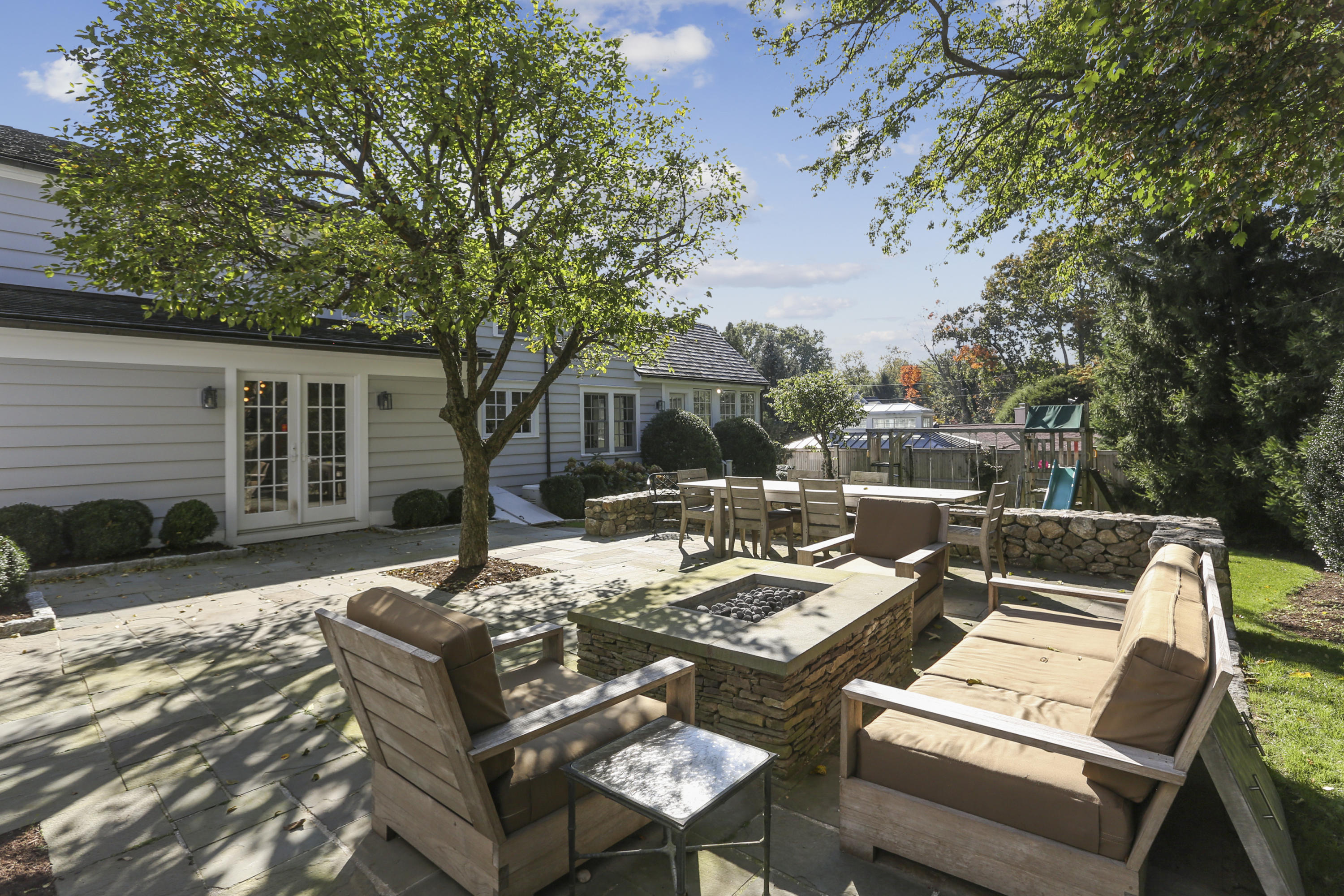 7 Bryan Road Norwalk, CT 06853 - Photo 32 of 37 a view of a patio with couches table and chairs and potted plants