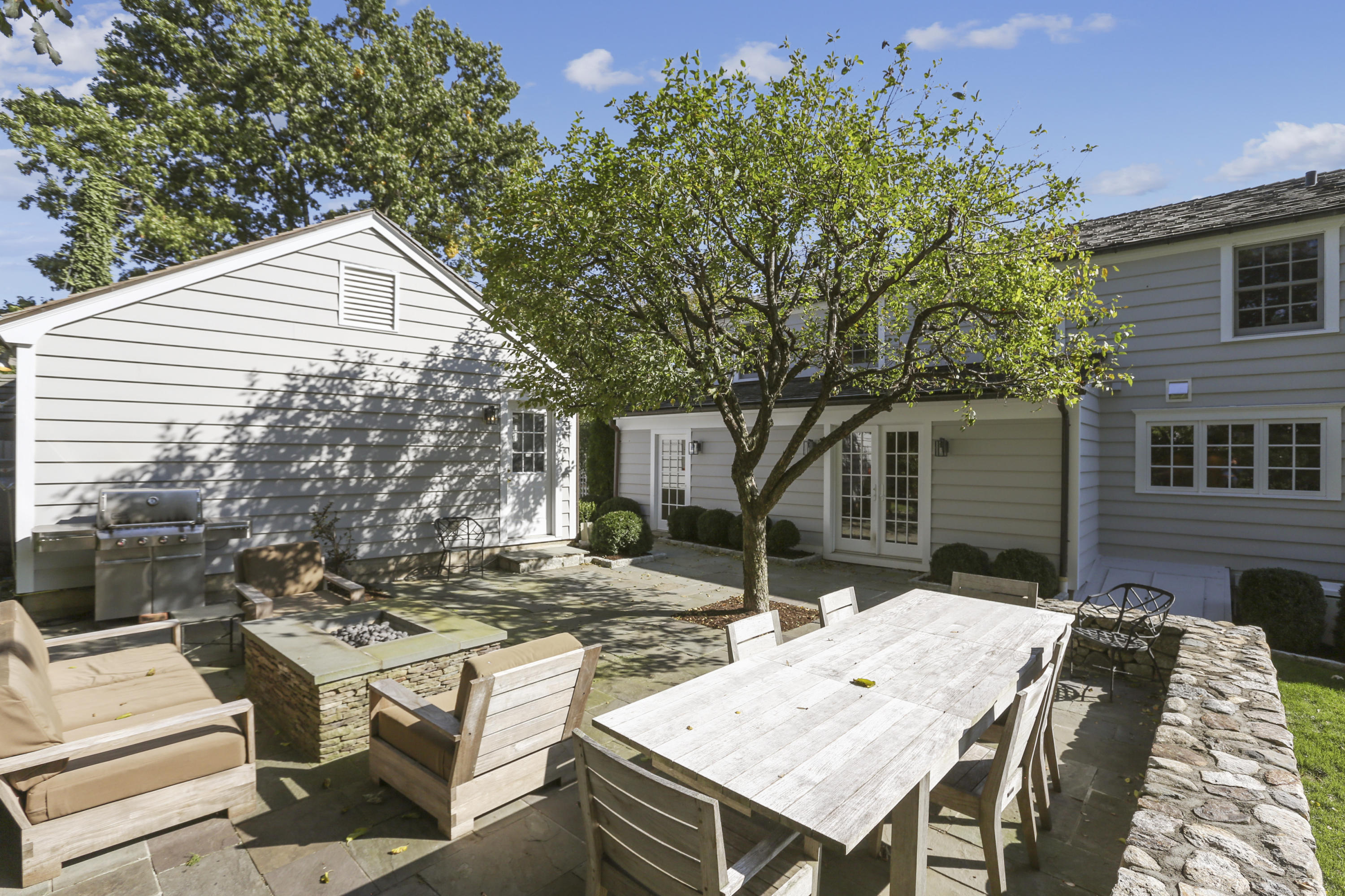 7 Bryan Road Norwalk, CT 06853 - Photo 33 of 37 a view of a patio with a table and chairs under an umbrella