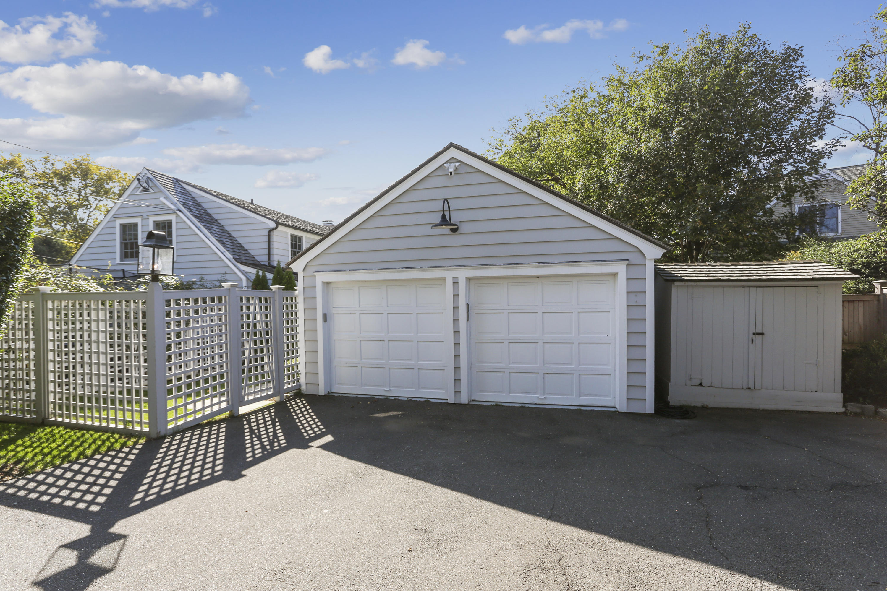 7 Bryan Road Norwalk, CT 06853 - Photo 34 of 37 a house view with a wooden fence