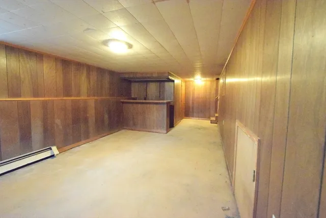 a view of house with backyard and deck