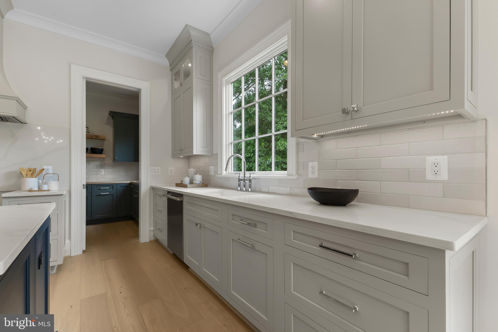 8628 Plymouth Road Alexandria, VA 22308 - Photo 18 of 50 a kitchen with a sink and cabinets