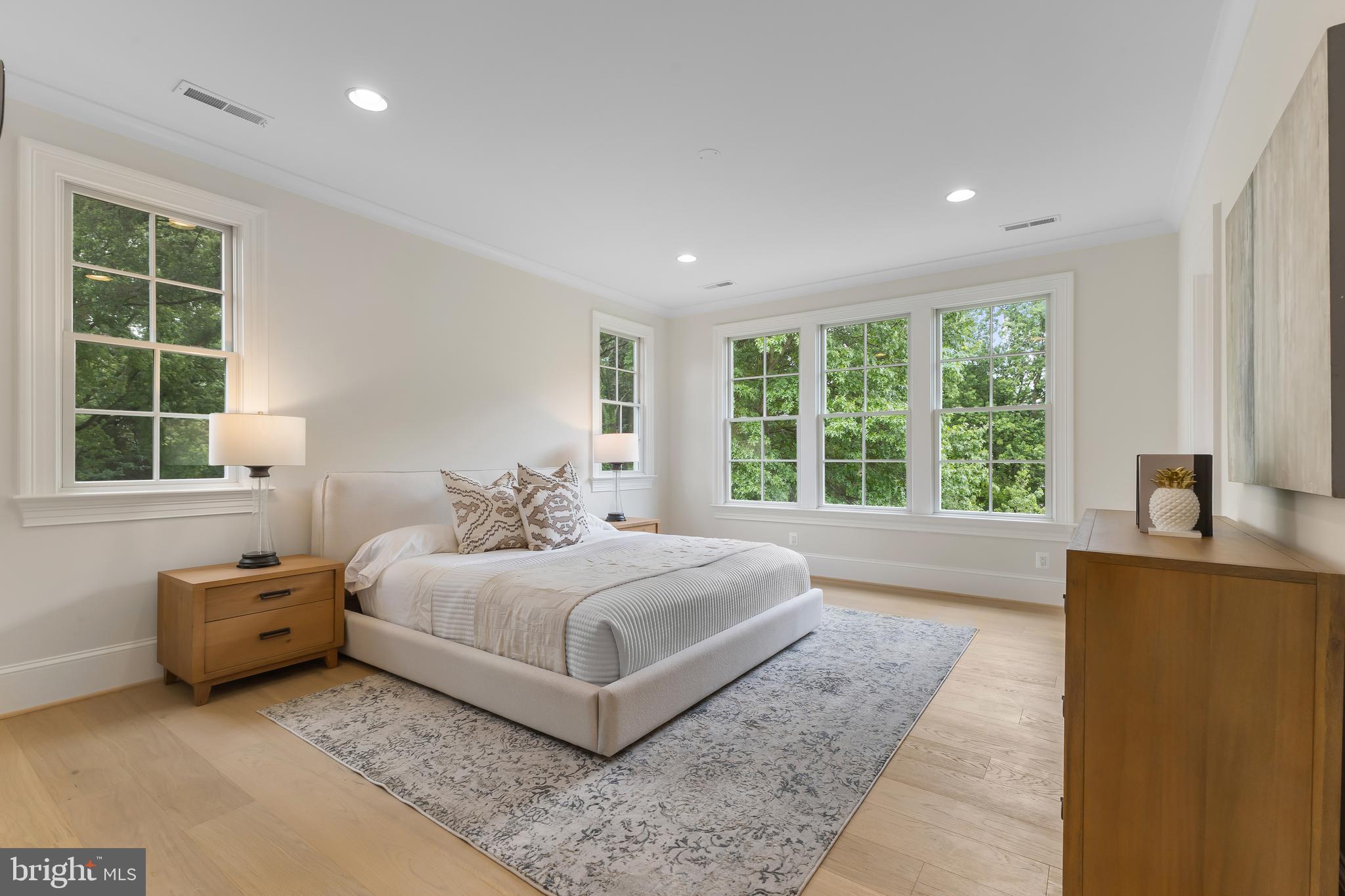 8628 Plymouth Road Alexandria, VA 22308 - Photo 28 of 50 a large bedroom with a bed and a large window