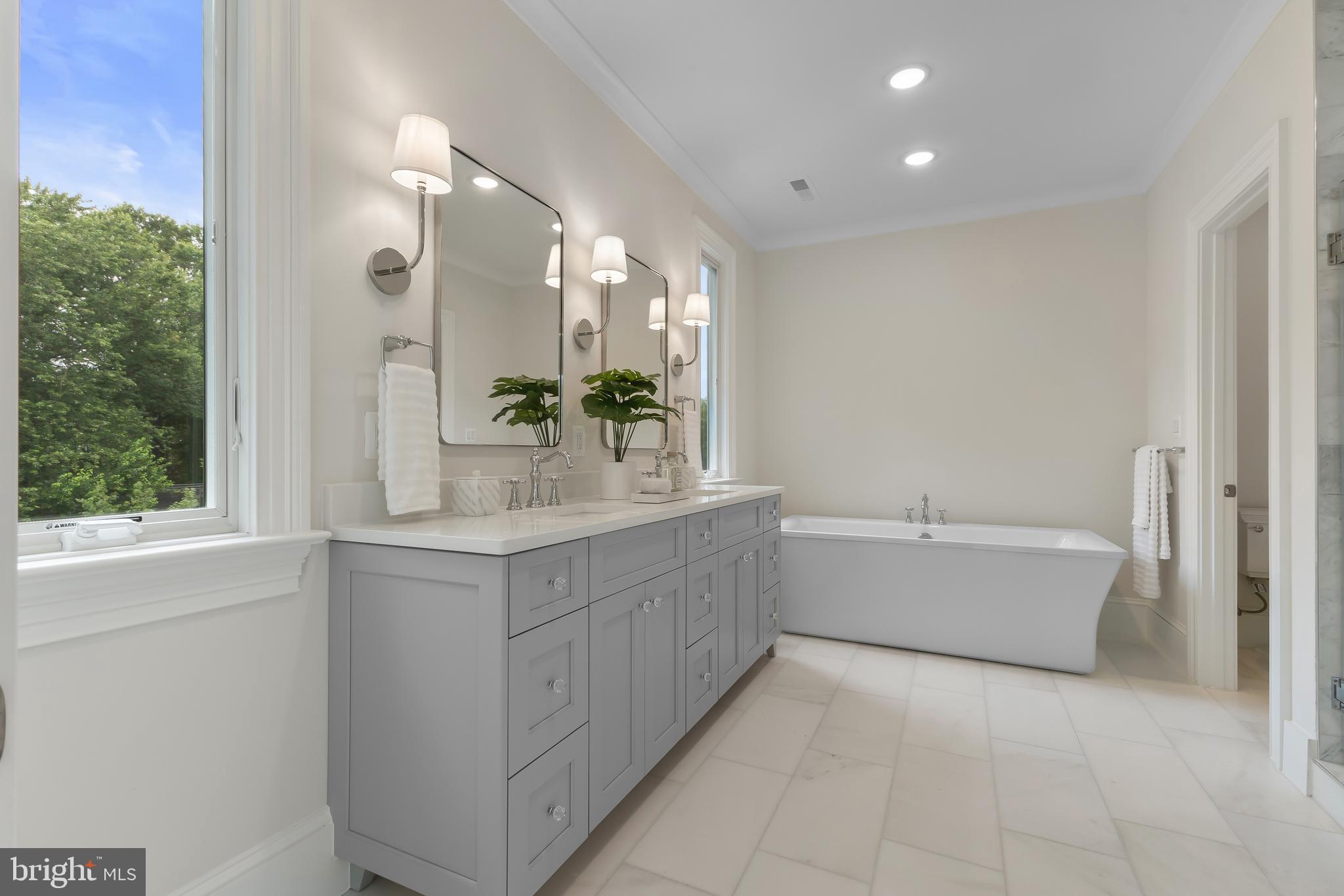 8628 Plymouth Road Alexandria, VA 22308 - Photo 30 of 50 a bathroom with a granite countertop sink mirror and a bathtub