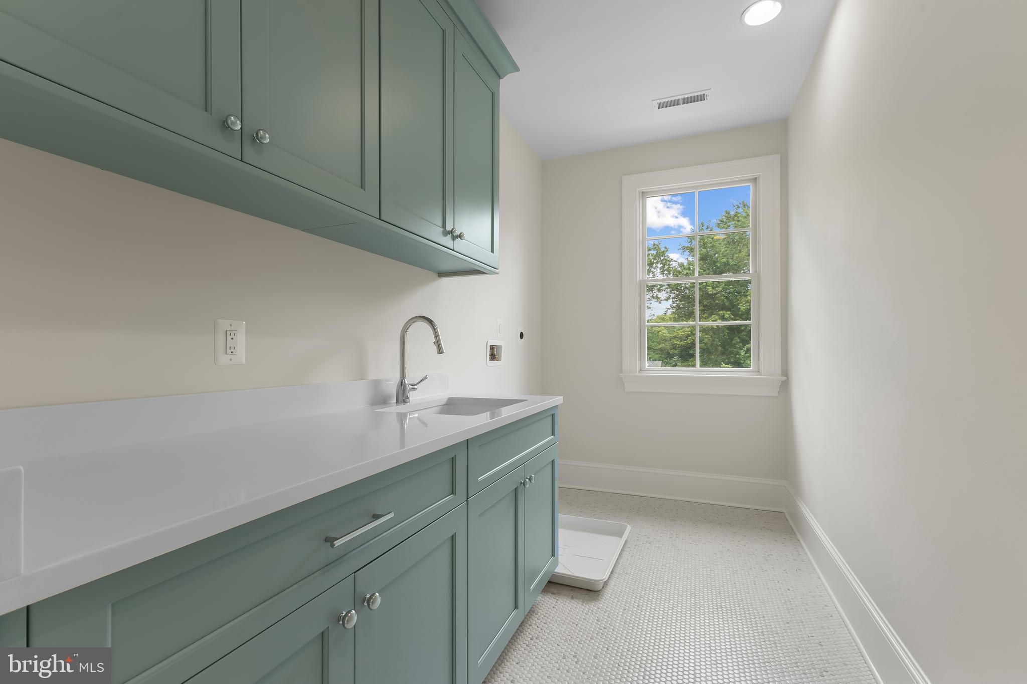 8628 Plymouth Road Alexandria, VA 22308 - Photo 35 of 50 a room with a sink cabinets and a window