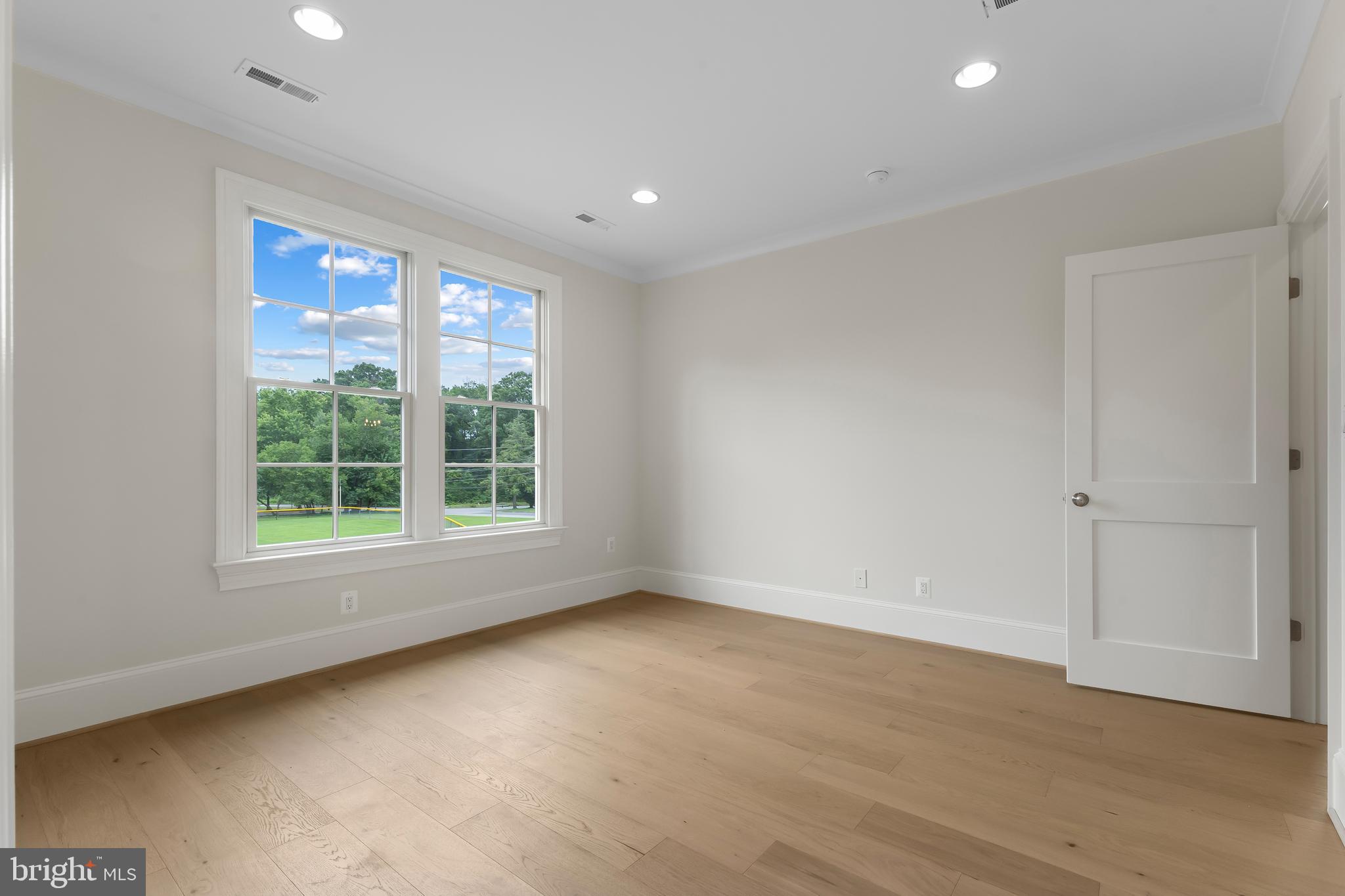 8628 Plymouth Road Alexandria, VA 22308 - Photo 40 of 50 wooden floor in an empty room with a window