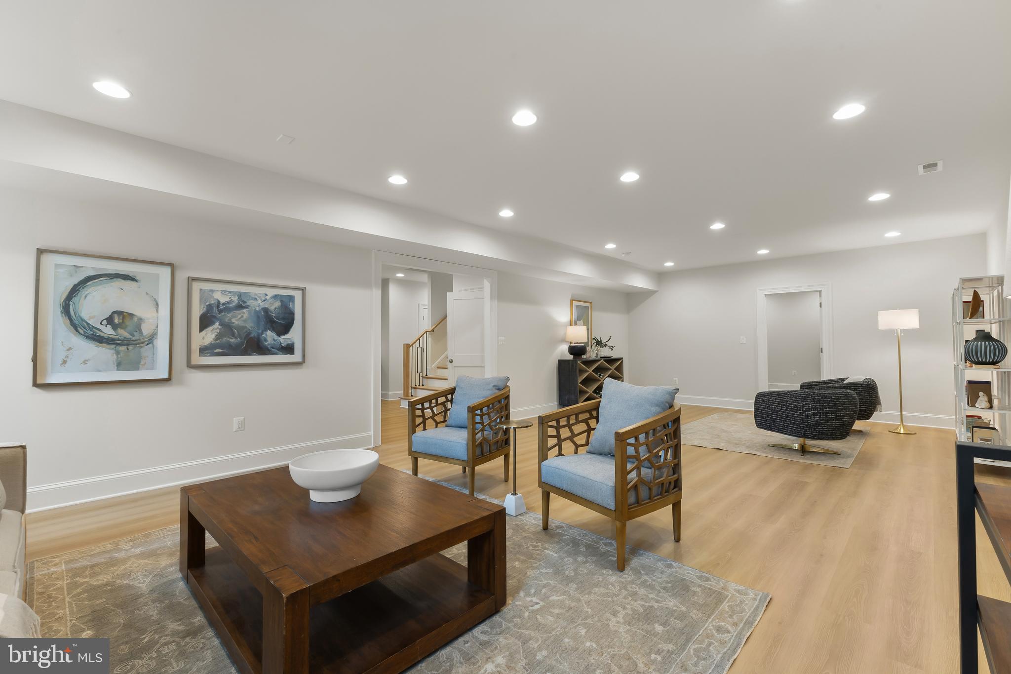 8628 Plymouth Road Alexandria, VA 22308 - Photo 45 of 50 a living room with furniture and a wooden floor