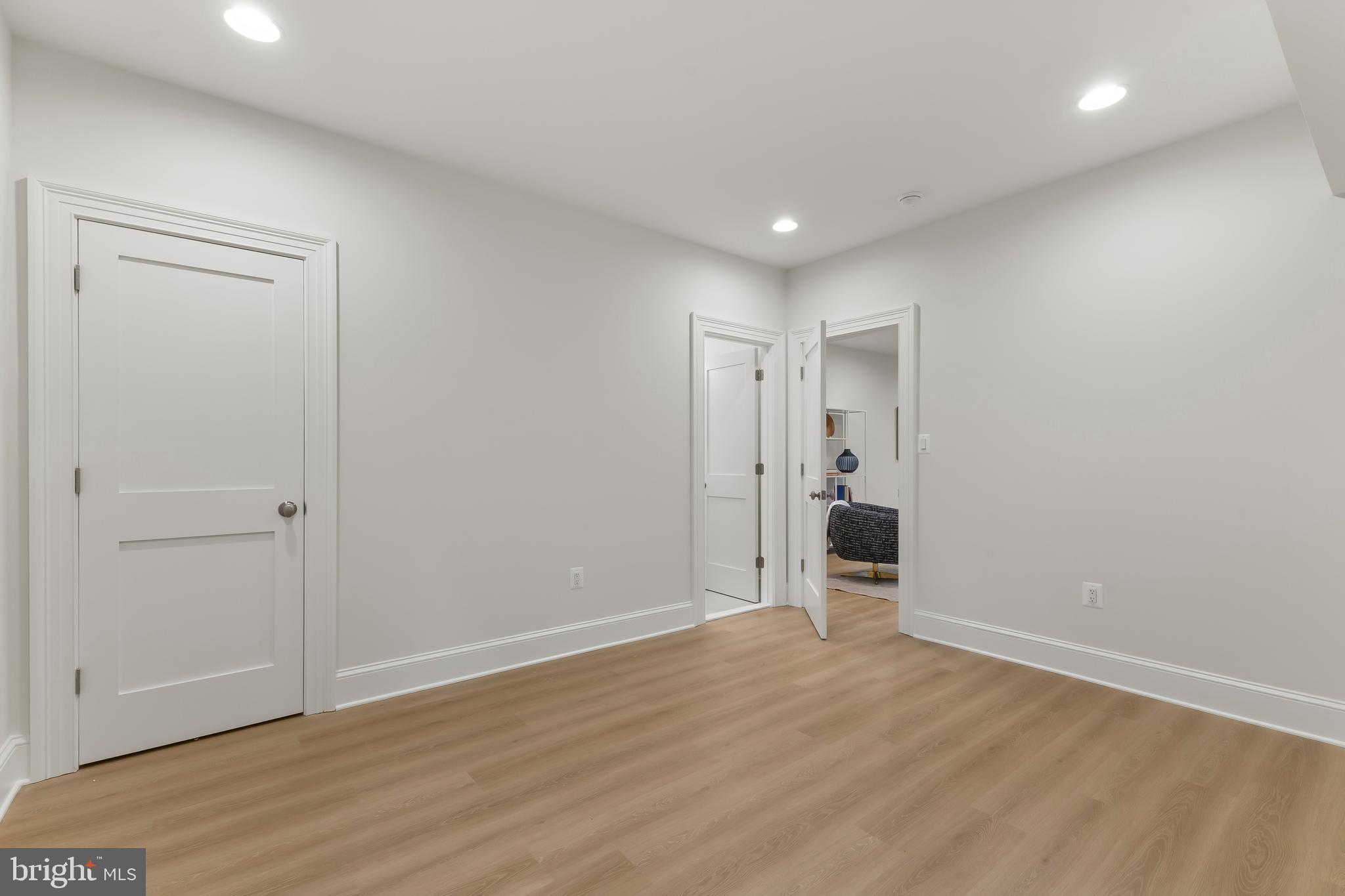 8628 Plymouth Road Alexandria, VA 22308 - Photo 48 of 50 a view of a big room with wooden floor and windows