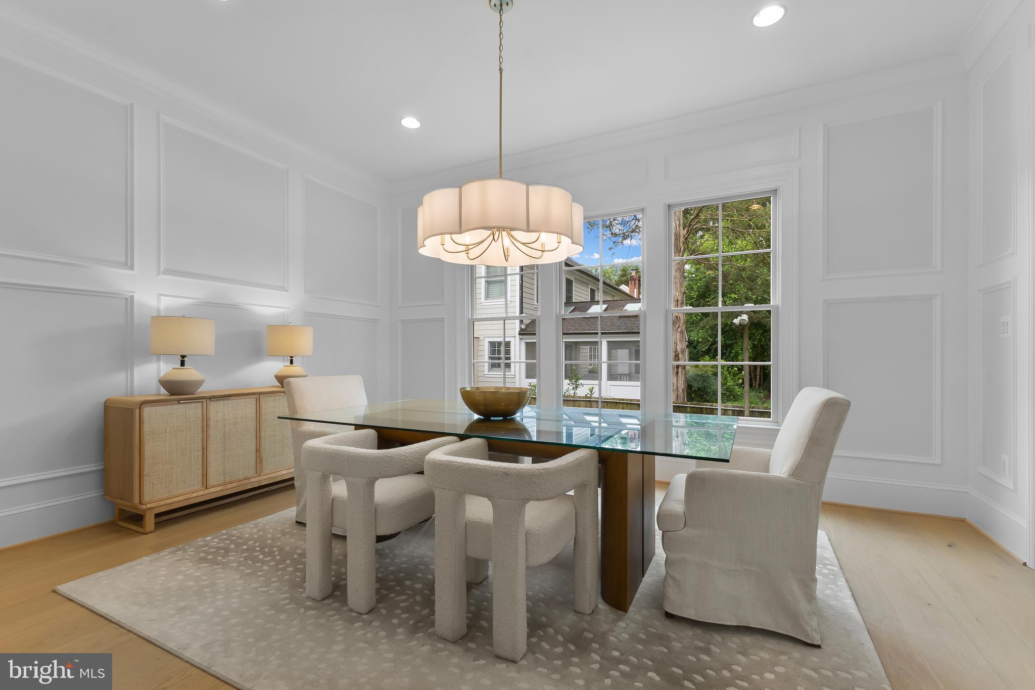 8628 Plymouth Road Alexandria, VA 22308 - Photo 6 of 50 a living room with furniture and a chandelier