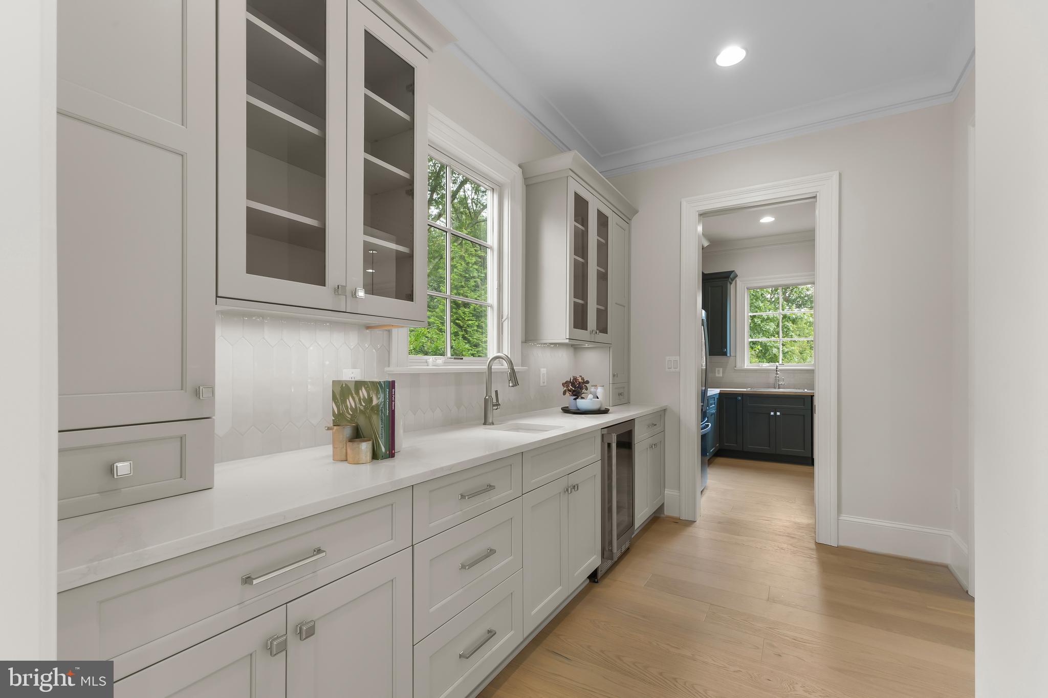 8628 Plymouth Road Alexandria, VA 22308 - Photo 7 of 50 a kitchen with a sink and cabinets