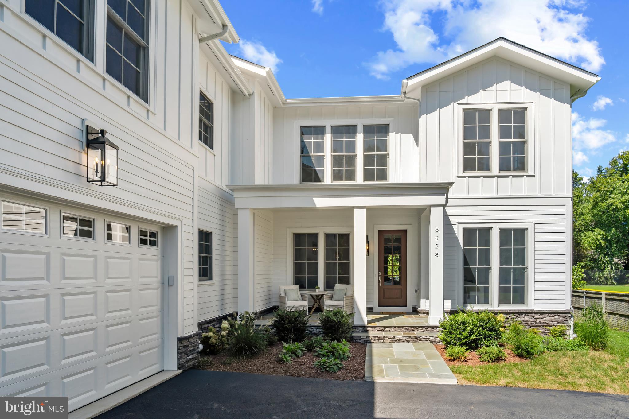 8628 Plymouth Road Alexandria, VA 22308 - Photo 9 of 50 a front view of a house with a yard