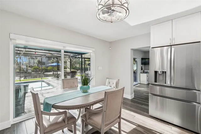 a bedroom with a large bed and a tv