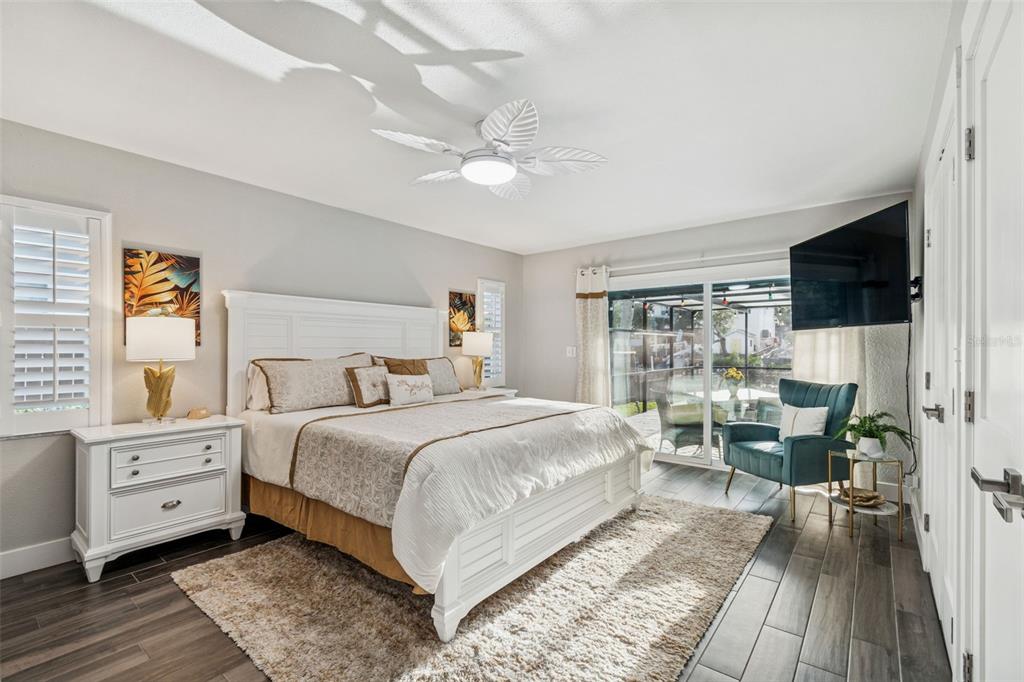 5809 Rio Drive New Port Richey, FL 34652 - Photo 17 of 61 a bedroom with a large bed and a tv