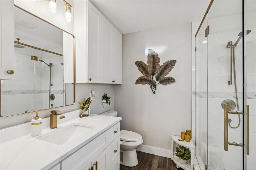 5809 Rio Drive New Port Richey, FL 34652 - Photo 18 of 61 a bathroom with a sink toilet and shower
