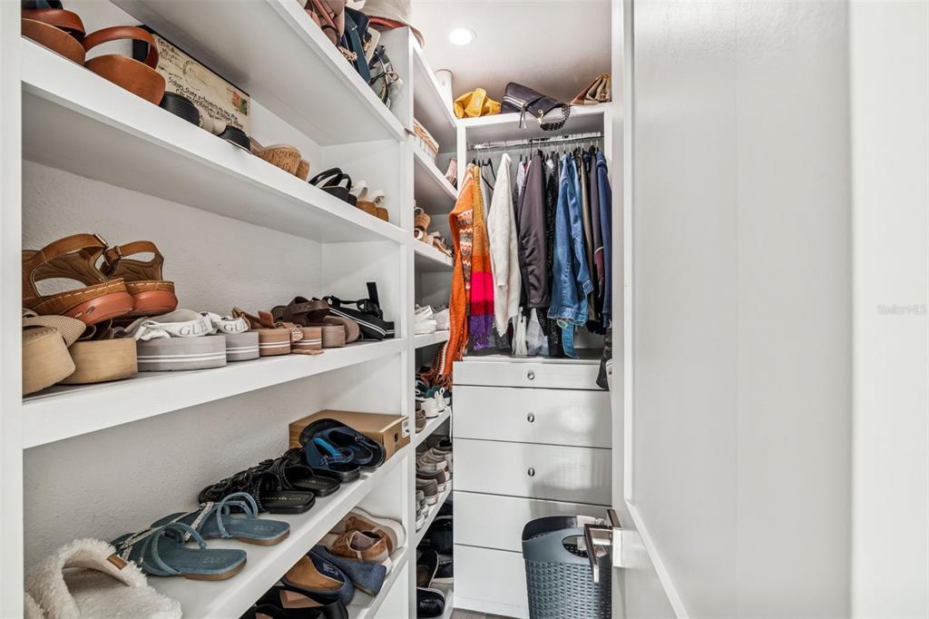 5809 Rio Drive New Port Richey, FL 34652 - Photo 19 of 61 a view of walk in closet with clothes and shoes