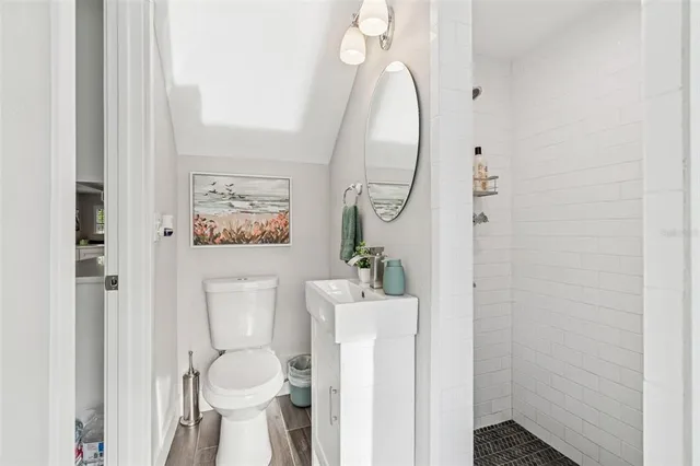 a spacious bedroom with bed and a couch