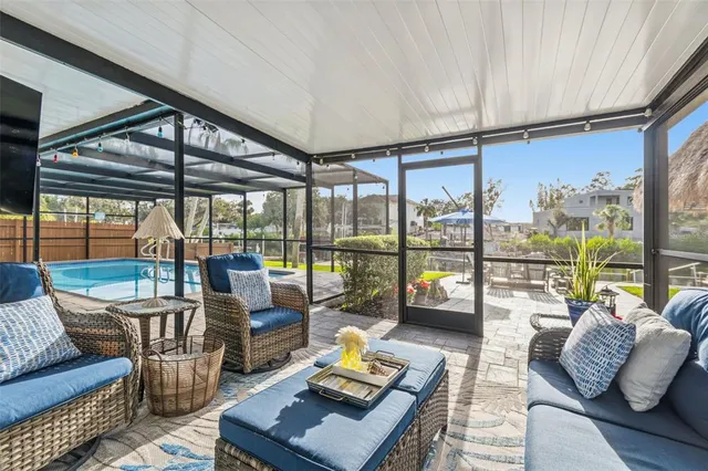a view of a backyard with sitting area