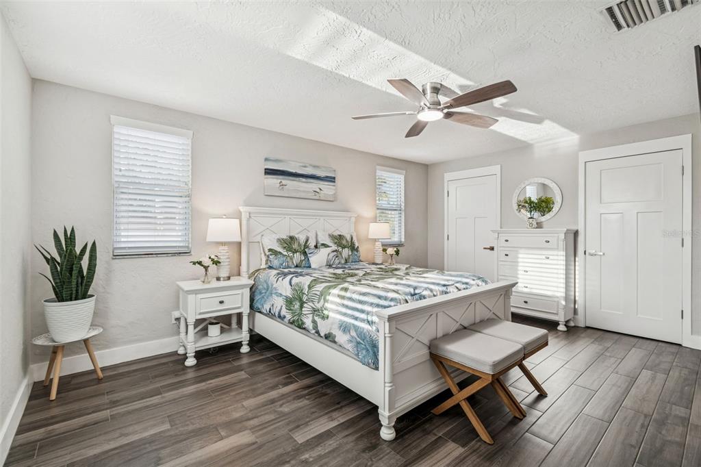 5809 Rio Drive New Port Richey, FL 34652 - Photo 33 of 61 a spacious bedroom with a bed and a table in it