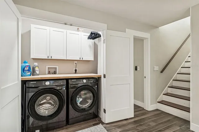 a view of a park with a slide and swing