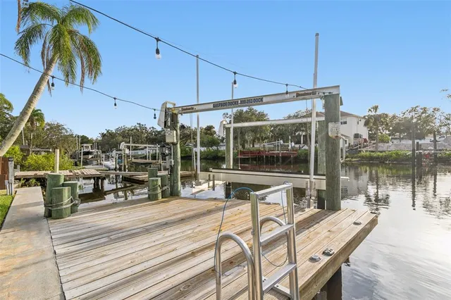 a view of a table and chairs under an umbrella