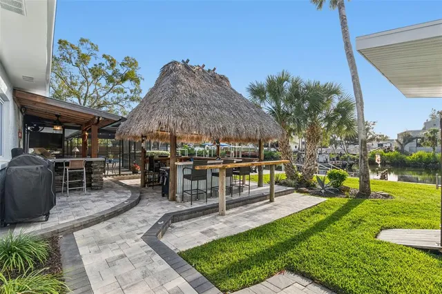 a view of a chairs and table in a patio
