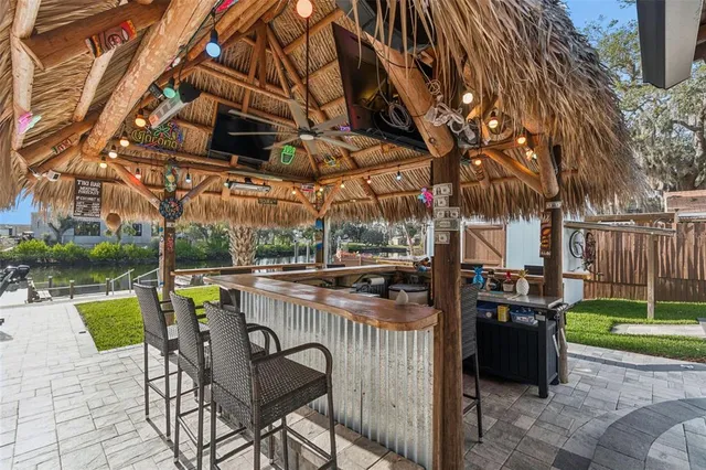 an aerial view of a house with garden space and street view