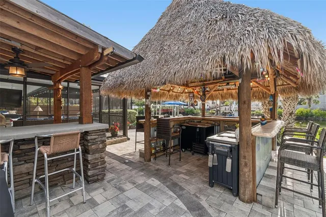 a view of a swimming pool with an outdoor seating