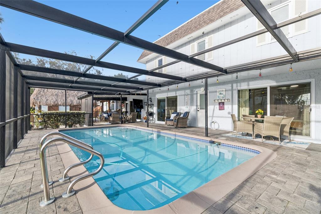 5809 Rio Drive New Port Richey, FL 34652 - Photo 54 of 61 a view of a swimming pool with a patio