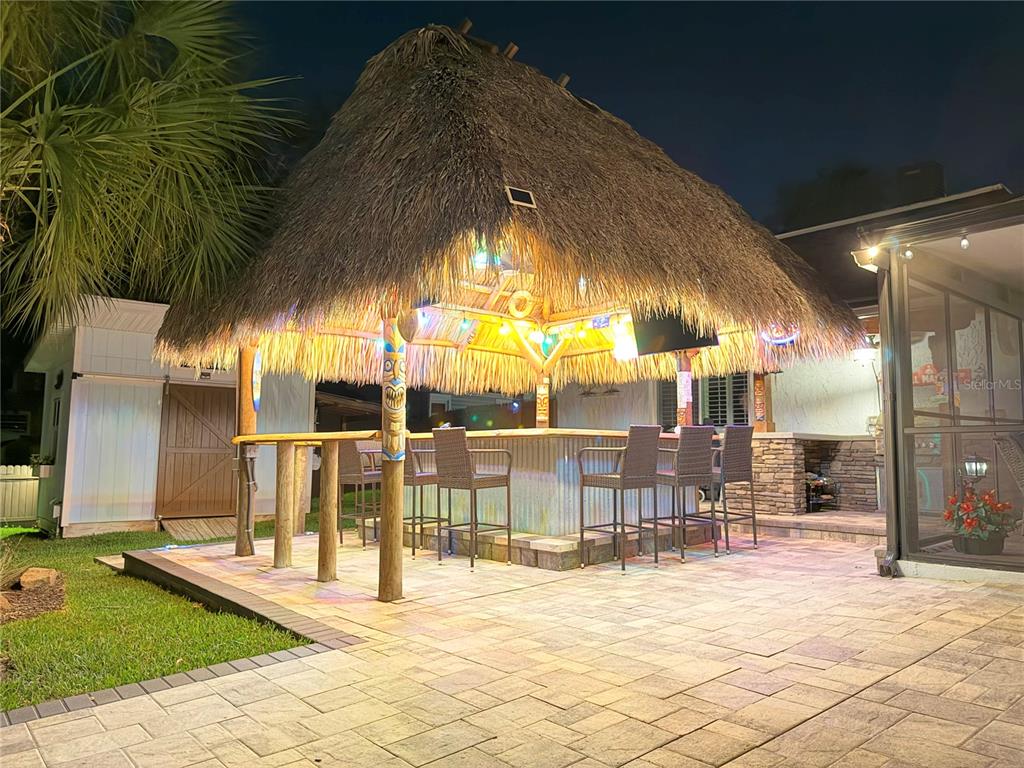 5809 Rio Drive New Port Richey, FL 34652 - Photo 60 of 61 a view of a swimming pool with a patio