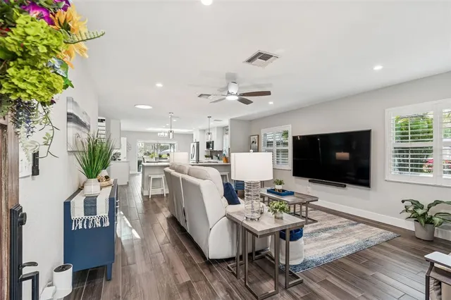 a kitchen with a sink stainless steel appliances and cabinets
