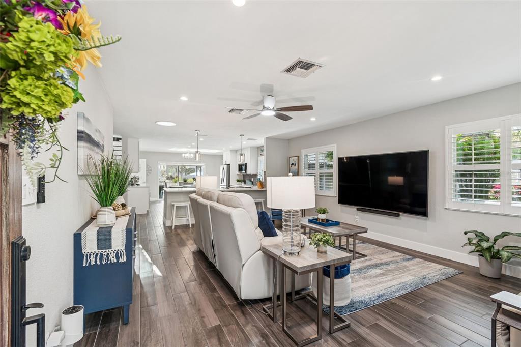 5809 Rio Drive New Port Richey, FL 34652 - Photo 9 of 61 a living room with furniture and a flat screen tv