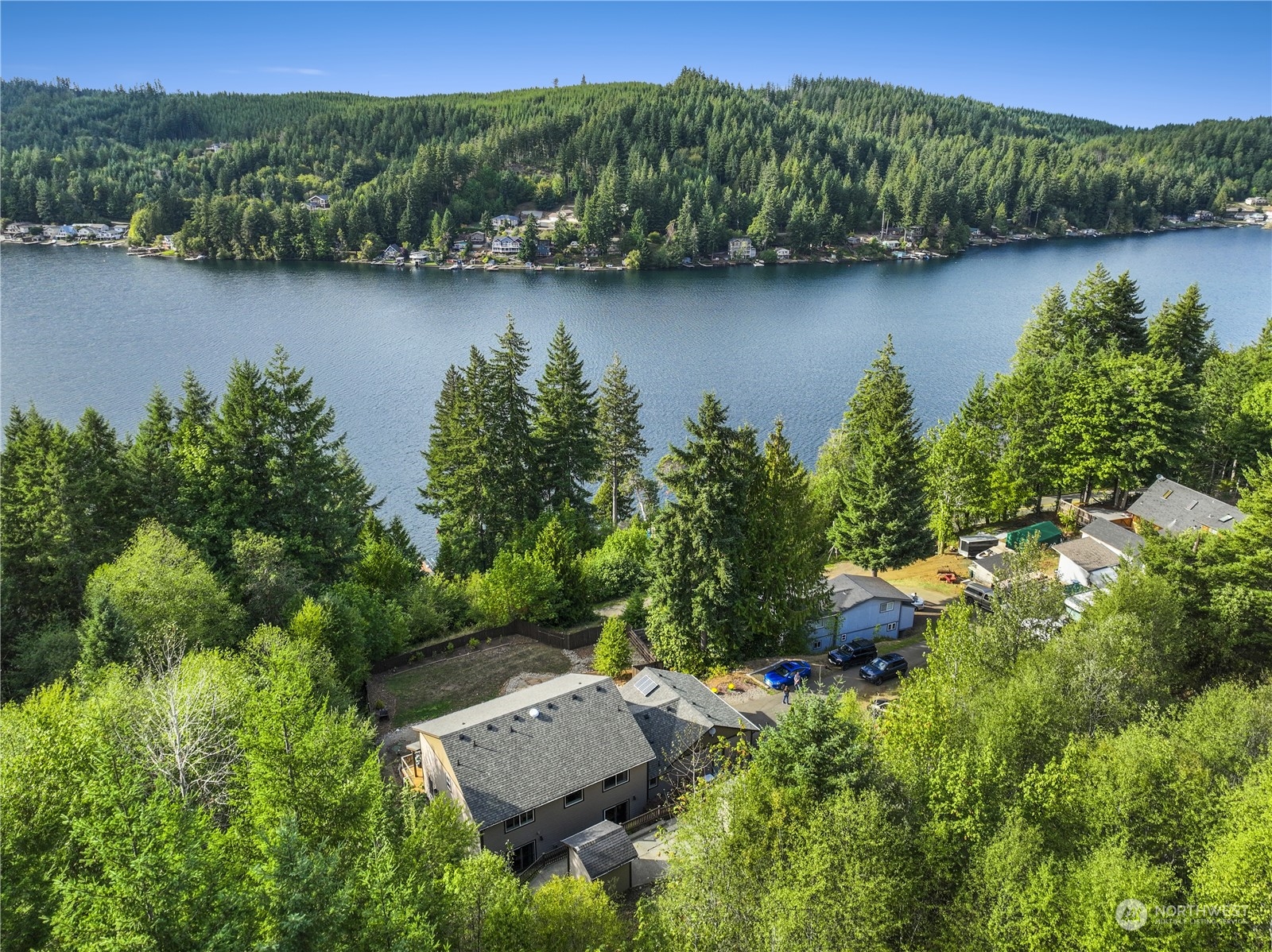 1124 Summit Lake Shore Road Northwest Olympia, WA 98502 - Photo 1 of 40 an aerial view of residential house with outdoor space and lake view