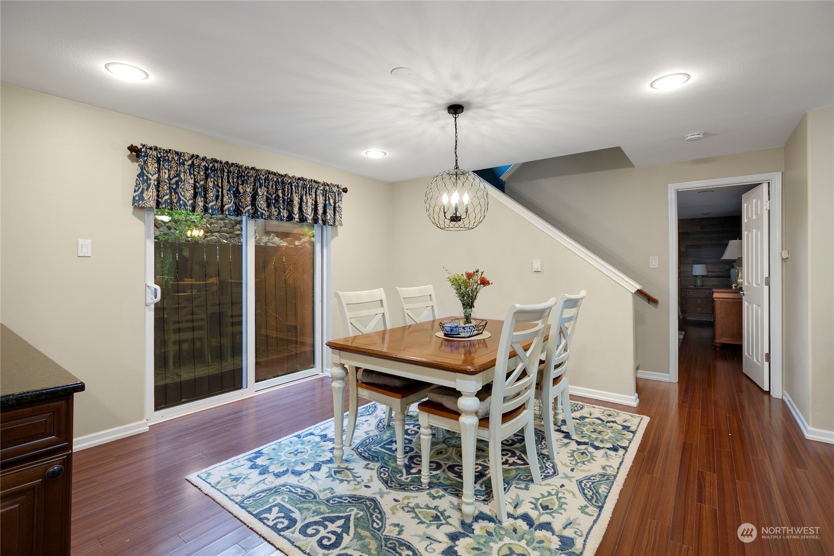 1124 Summit Lake Shore Road Northwest Olympia, WA 98502 - Photo 14 of 40 a view of a dining room with furniture and wooden floor
