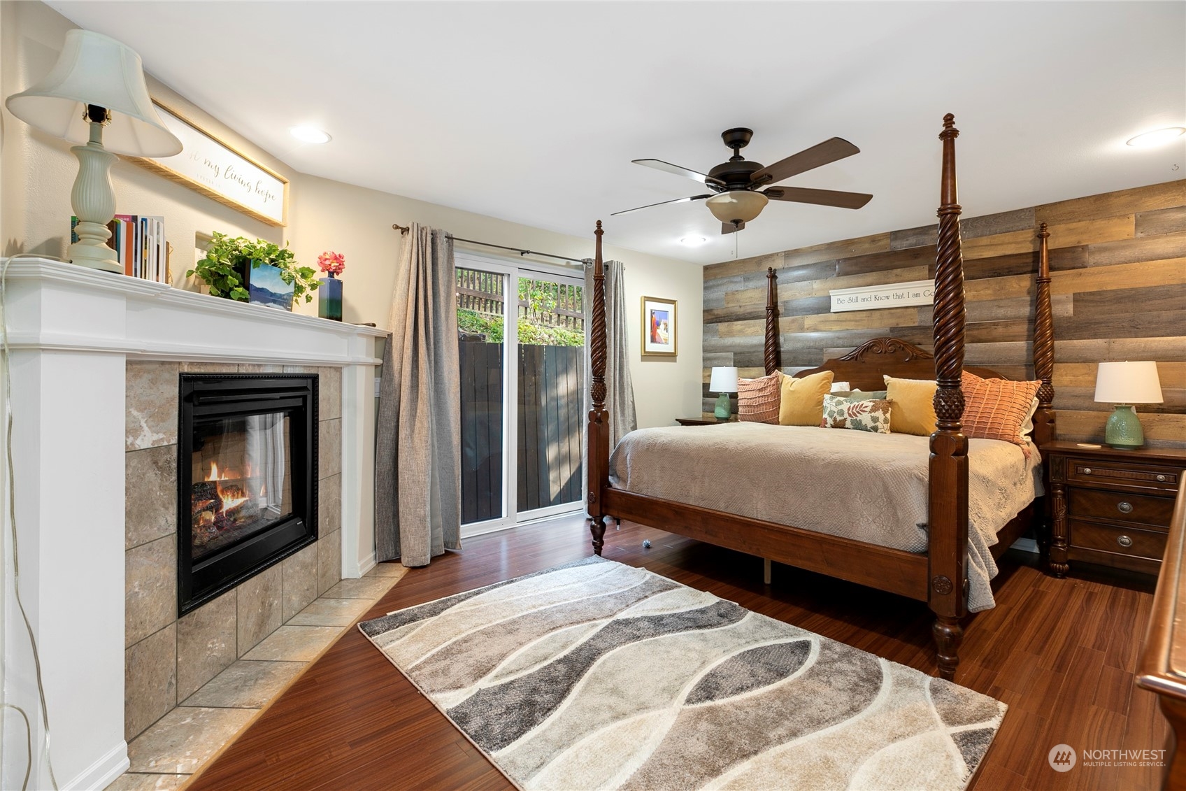 1124 Summit Lake Shore Road Northwest Olympia, WA 98502 - Photo 15 of 40 a bedroom with a bed and a fireplace