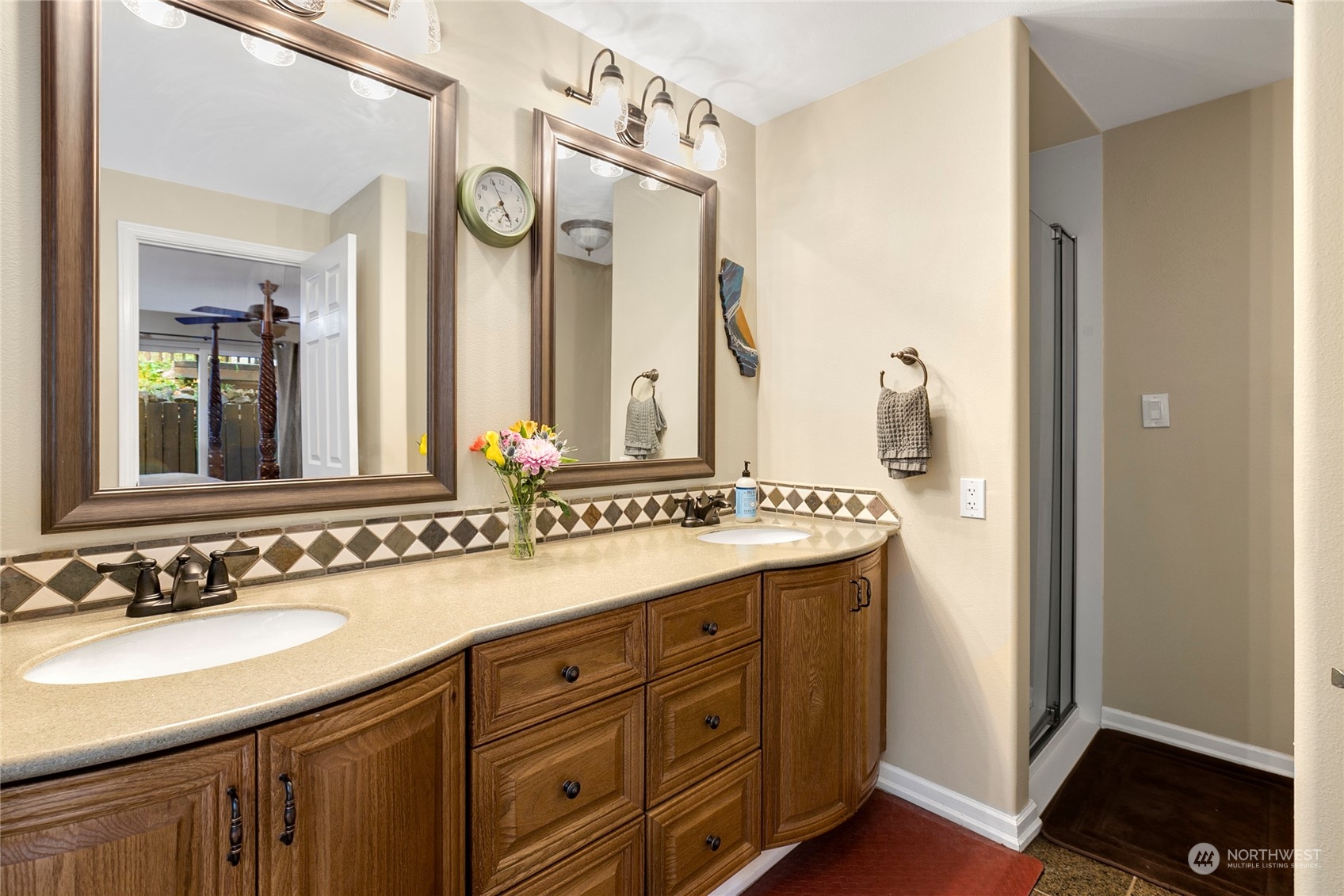 1124 Summit Lake Shore Road Northwest Olympia, WA 98502 - Photo 18 of 40 a bathroom with a granite countertop sink and a mirror