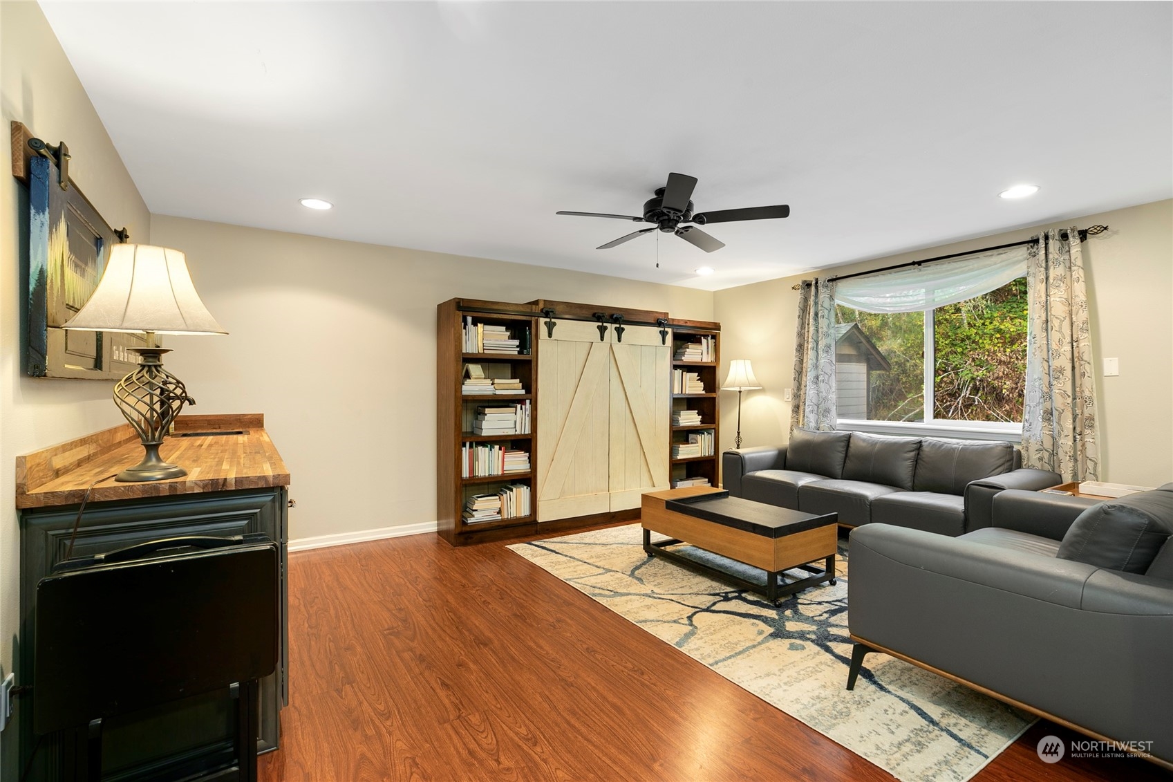 1124 Summit Lake Shore Road Northwest Olympia, WA 98502 - Photo 21 of 40 a living room with furniture and a window