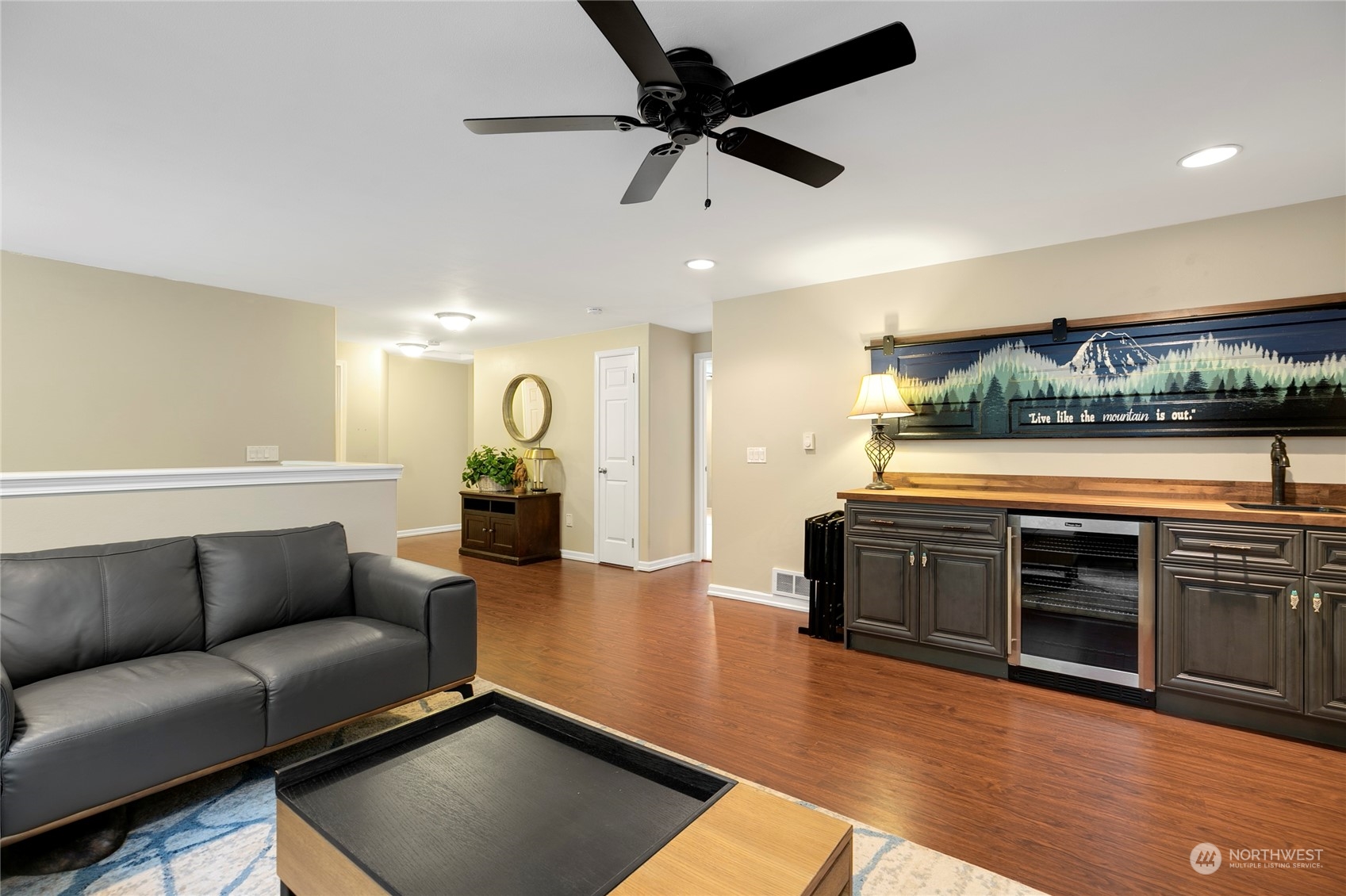 1124 Summit Lake Shore Road Northwest Olympia, WA 98502 - Photo 22 of 40 a living room with furniture and a wooden floor