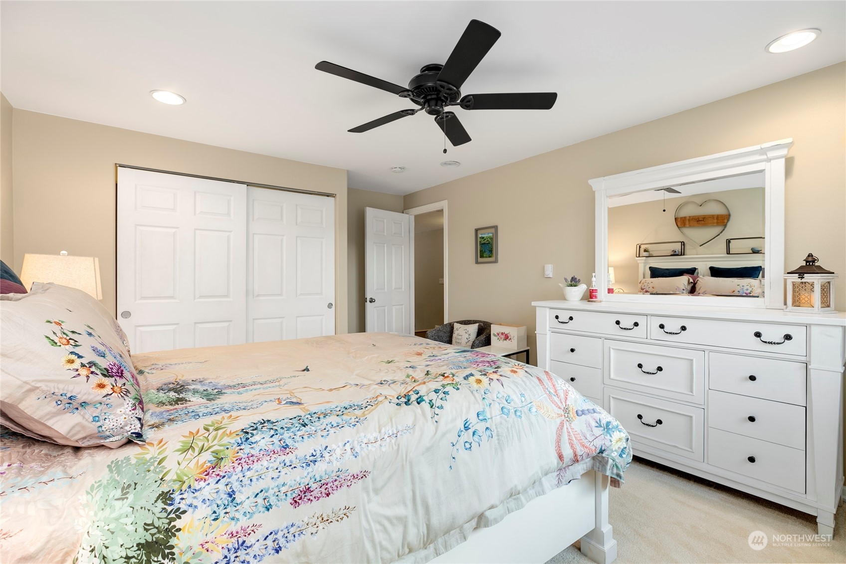 1124 Summit Lake Shore Road Northwest Olympia, WA 98502 - Photo 24 of 40 a bedroom with a bed and a dresser