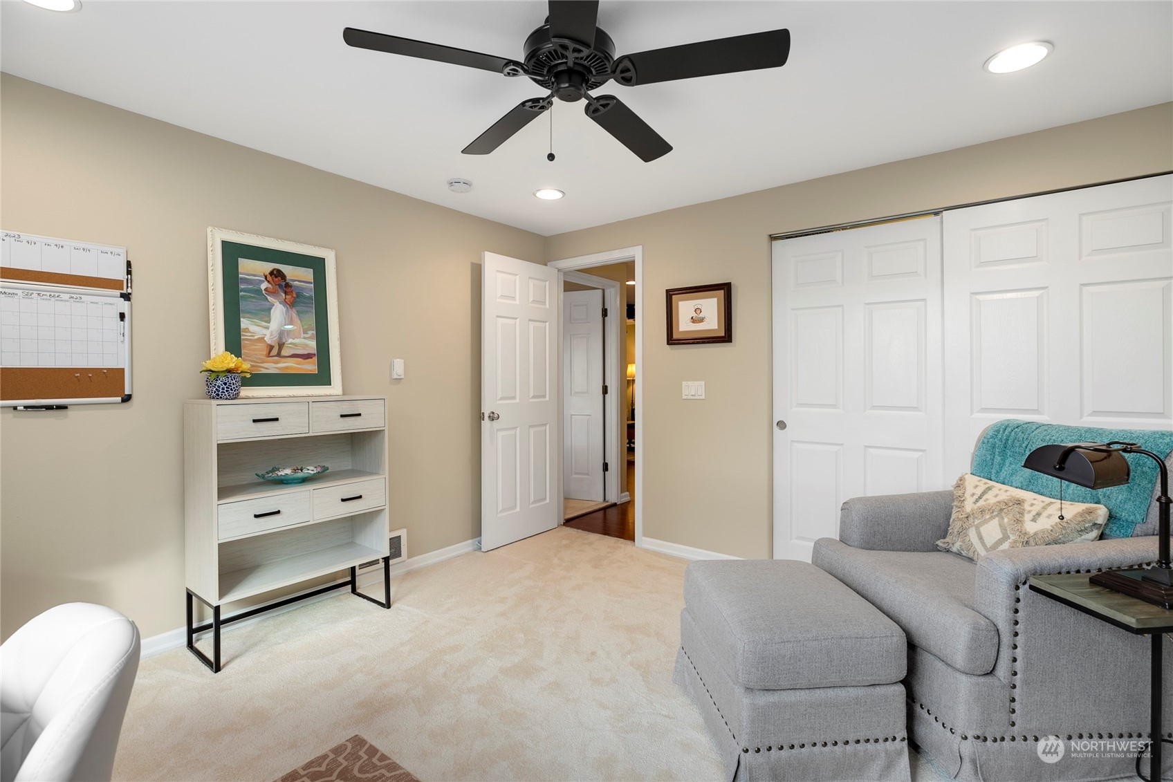1124 Summit Lake Shore Road Northwest Olympia, WA 98502 - Photo 26 of 40 a bedroom with furniture and a chandelier