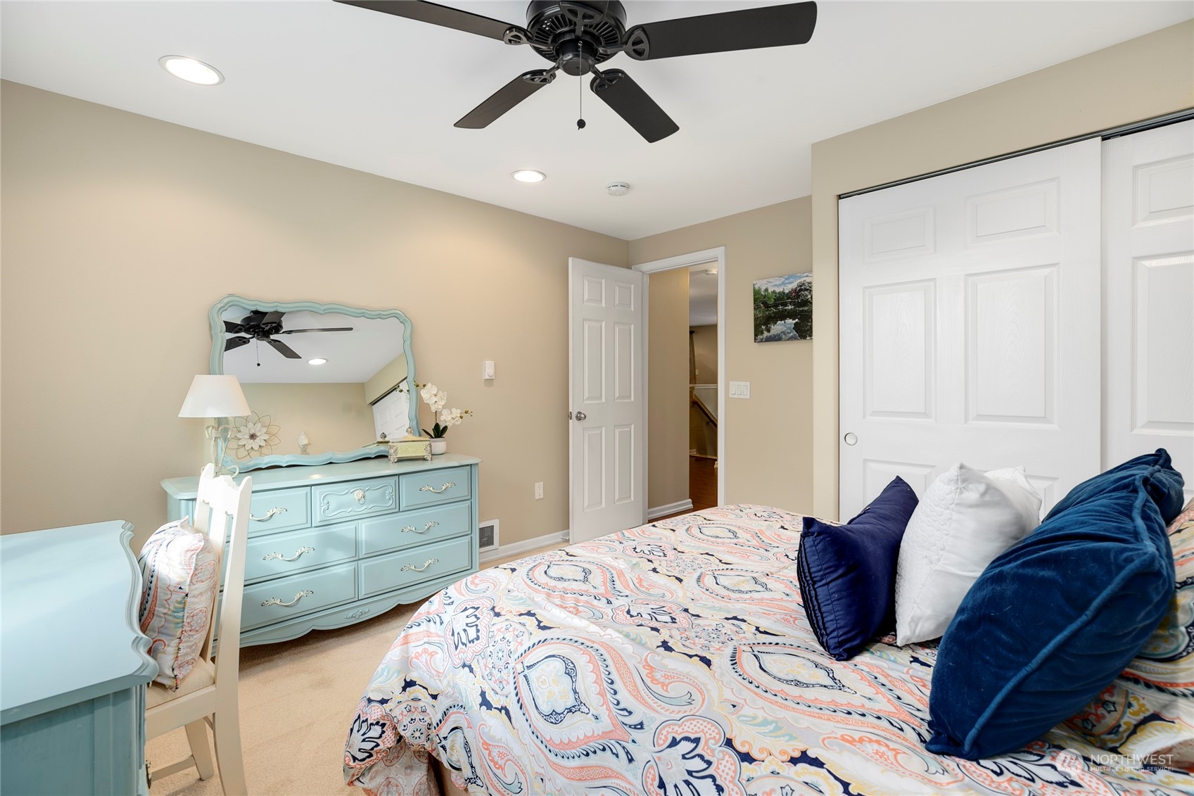 1124 Summit Lake Shore Road Northwest Olympia, WA 98502 - Photo 29 of 40 a bedroom with a bed and ceiling fan