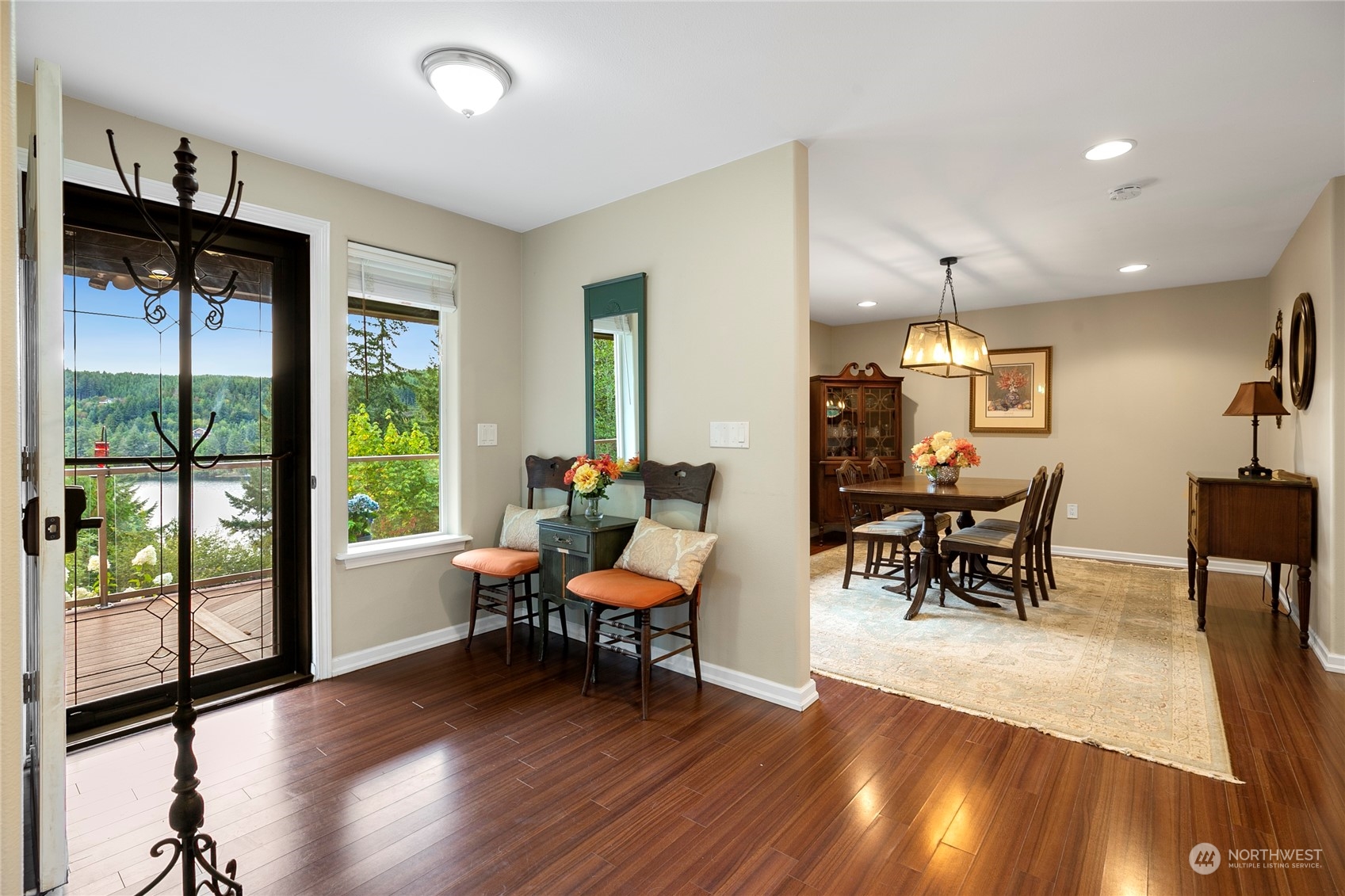 1124 Summit Lake Shore Road Northwest Olympia, WA 98502 - Photo 3 of 40 a view of a a dining room with furniture window and wooden floor