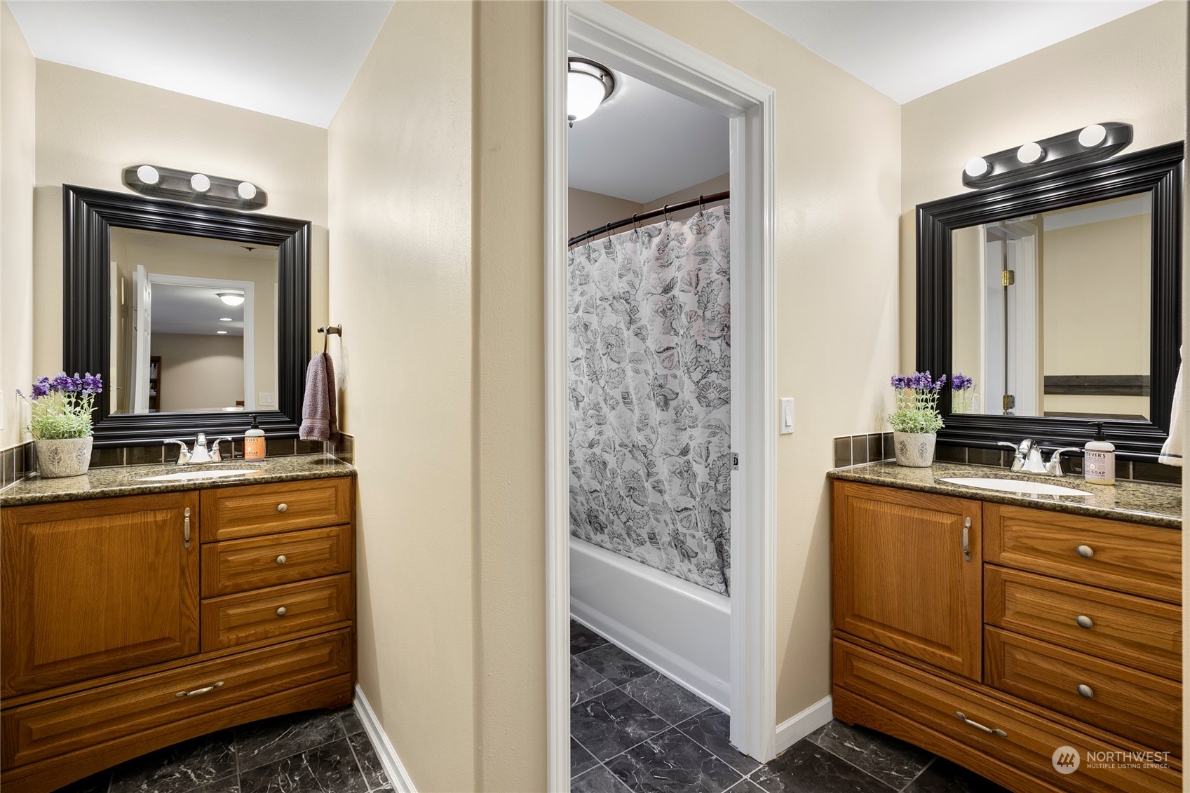 1124 Summit Lake Shore Road Northwest Olympia, WA 98502 - Photo 31 of 40 a bathroom with a sink a mirror and a shower