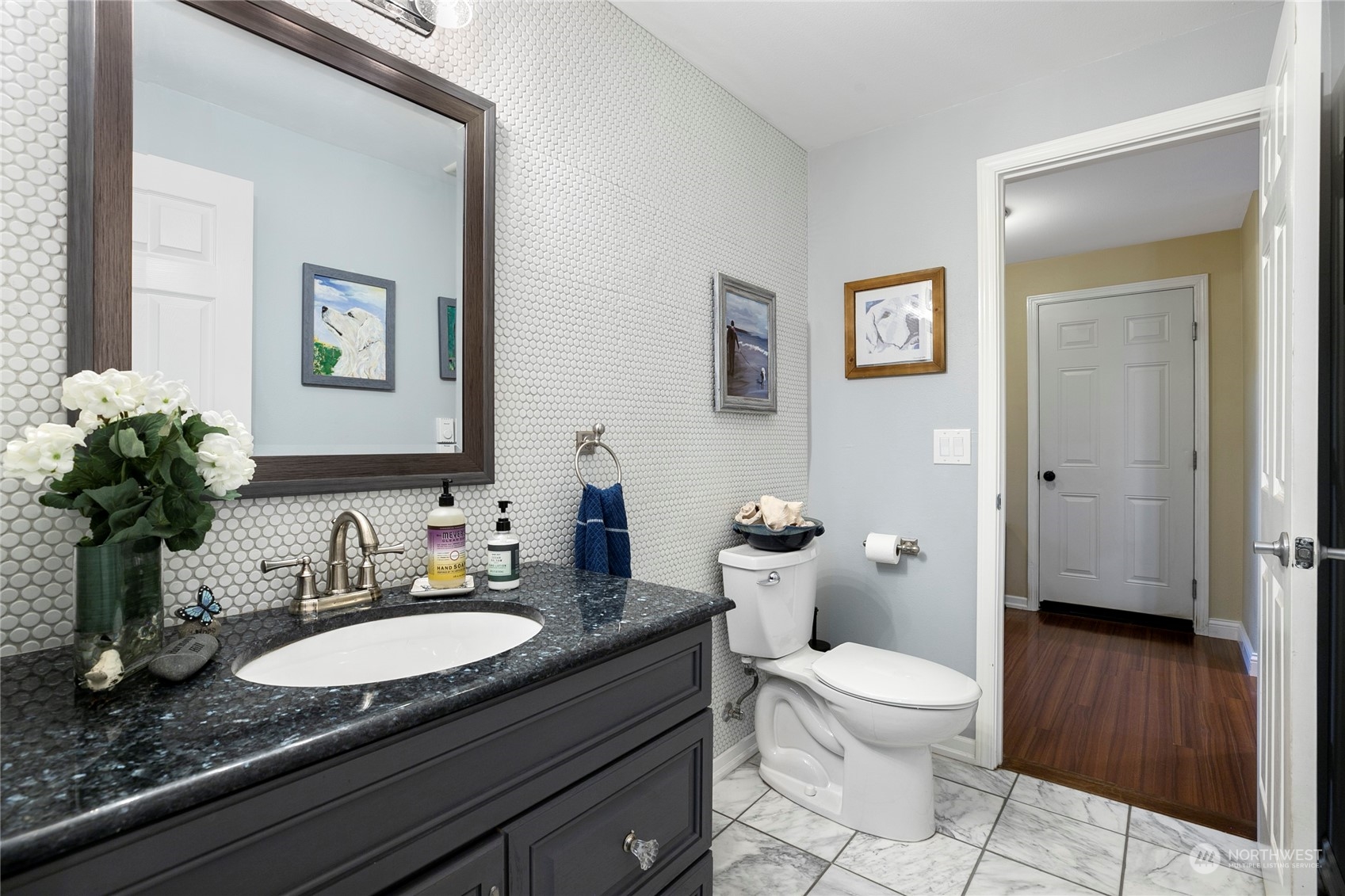 1124 Summit Lake Shore Road Northwest Olympia, WA 98502 - Photo 34 of 40 a bathroom with a granite countertop toilet a sink and a mirror